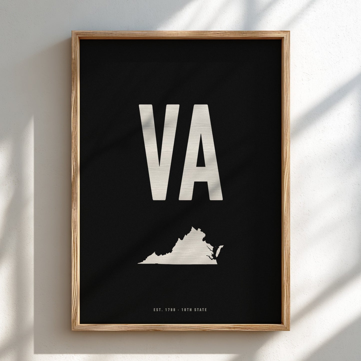 Framed poster with 'VA' and a map of Virginia on a black background