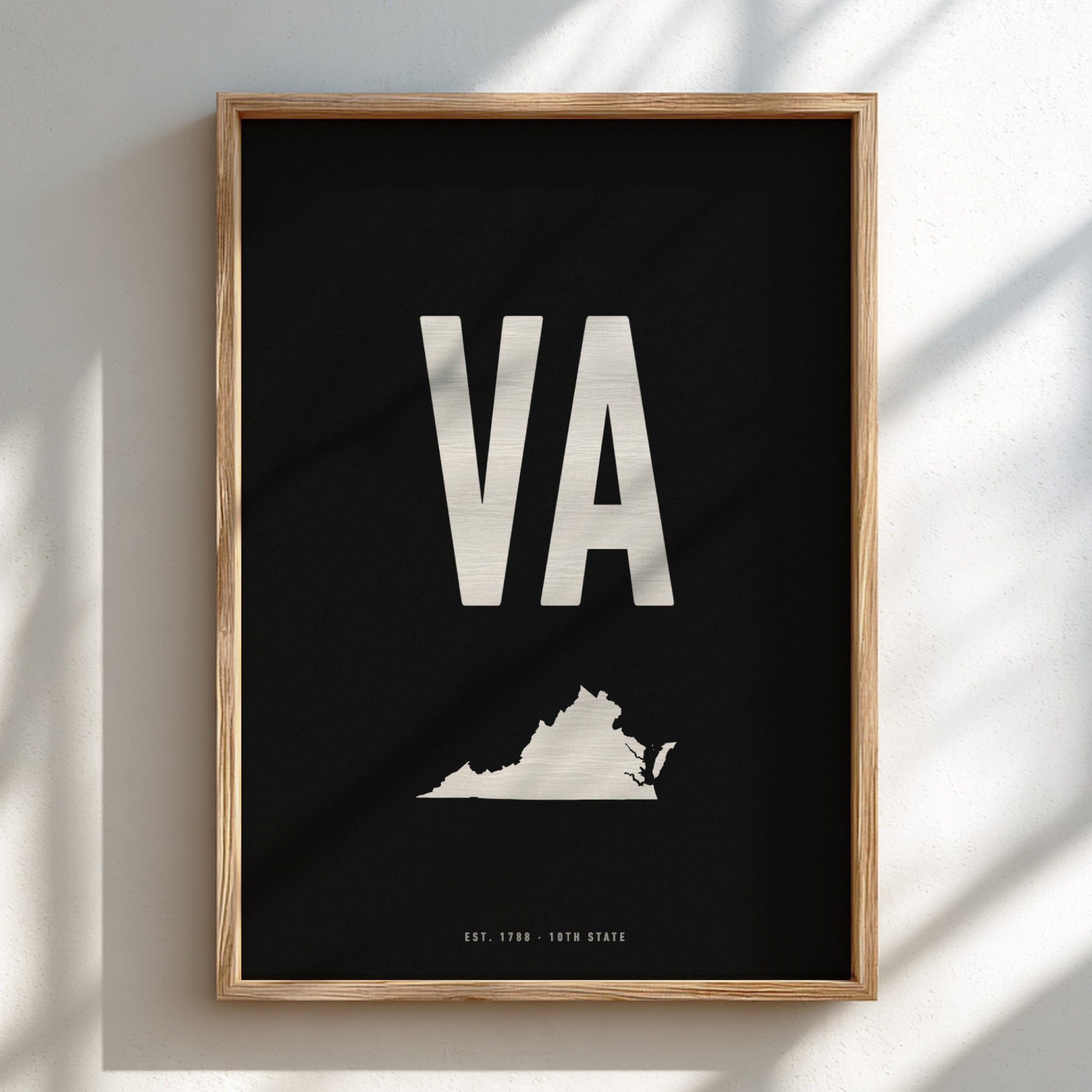 Framed poster with 'VA' and a map of Virginia on a black background