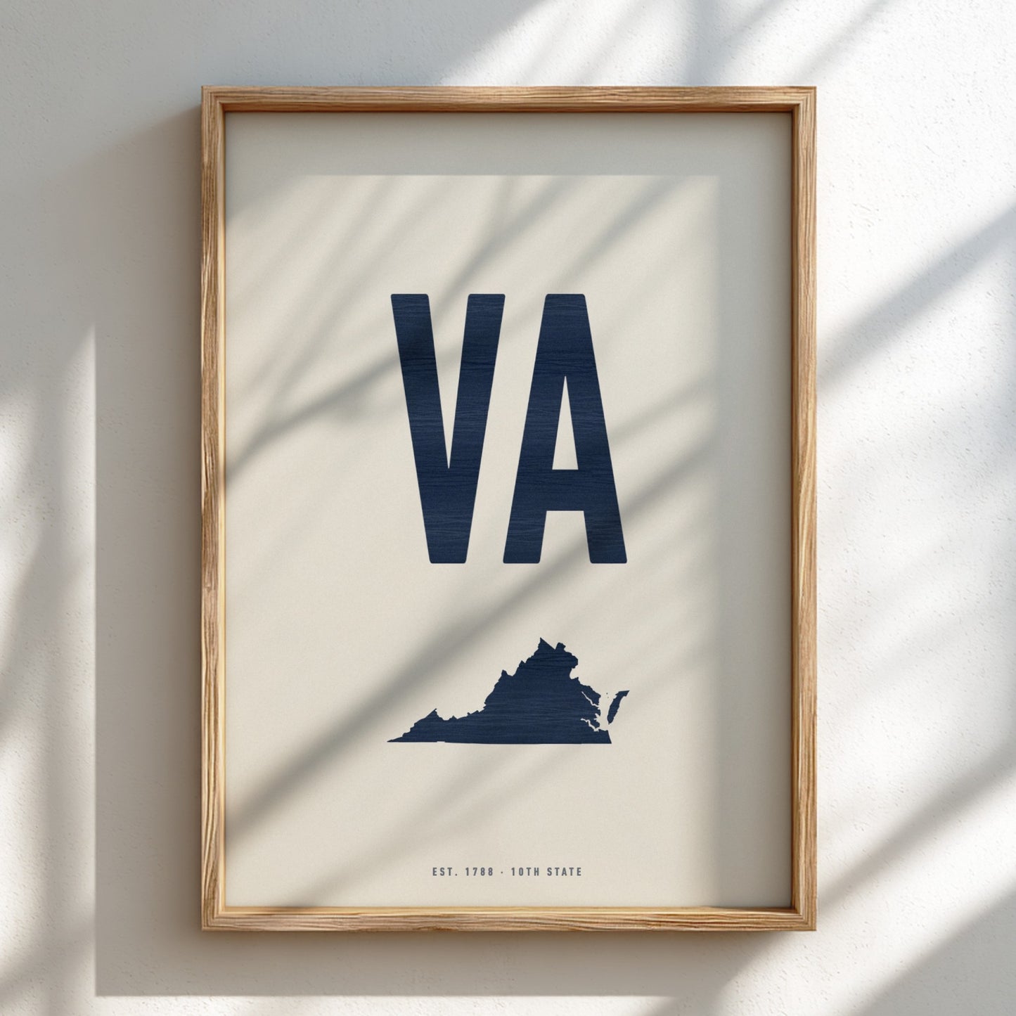 Framed poster with 'VA' and a map of Virginia on a light background