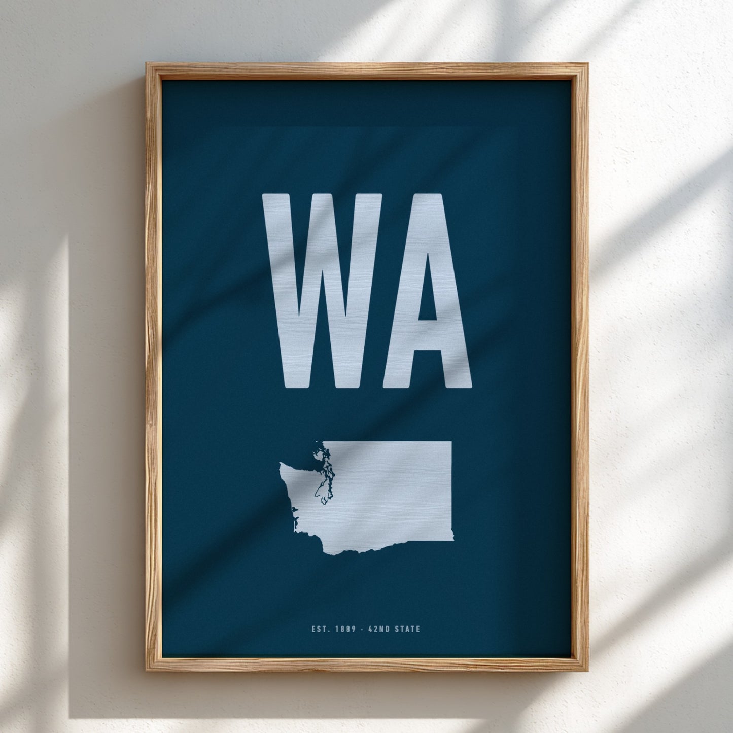 Framed poster with 'WA' and a map of Washington state on a blue background