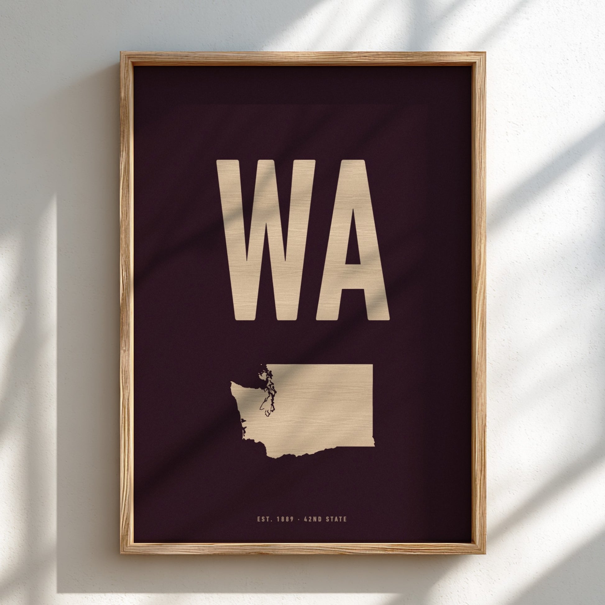 Framed poster with 'WA' and a map of Washington state on a dark background