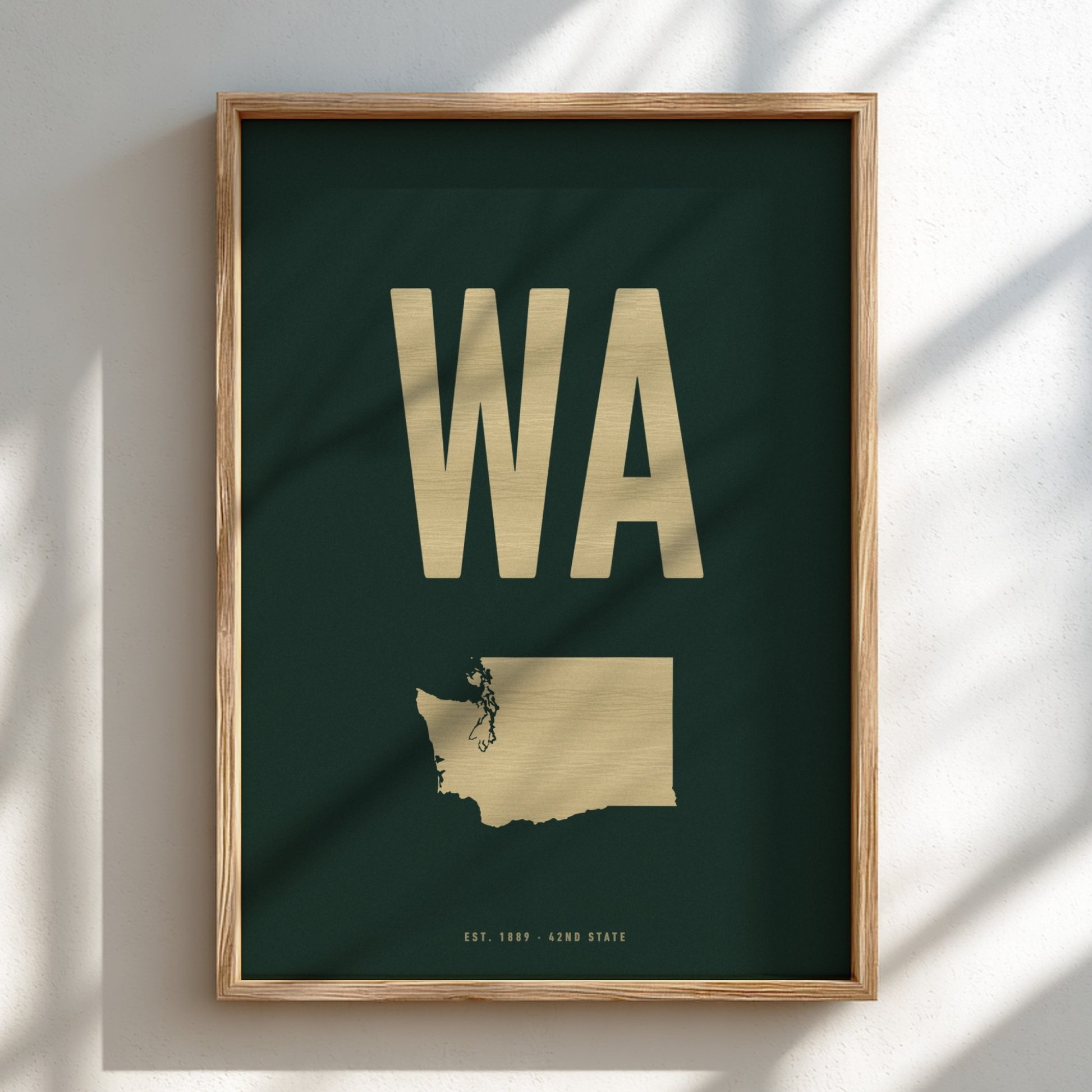 Framed poster with 'WA' in gold on a dark green background