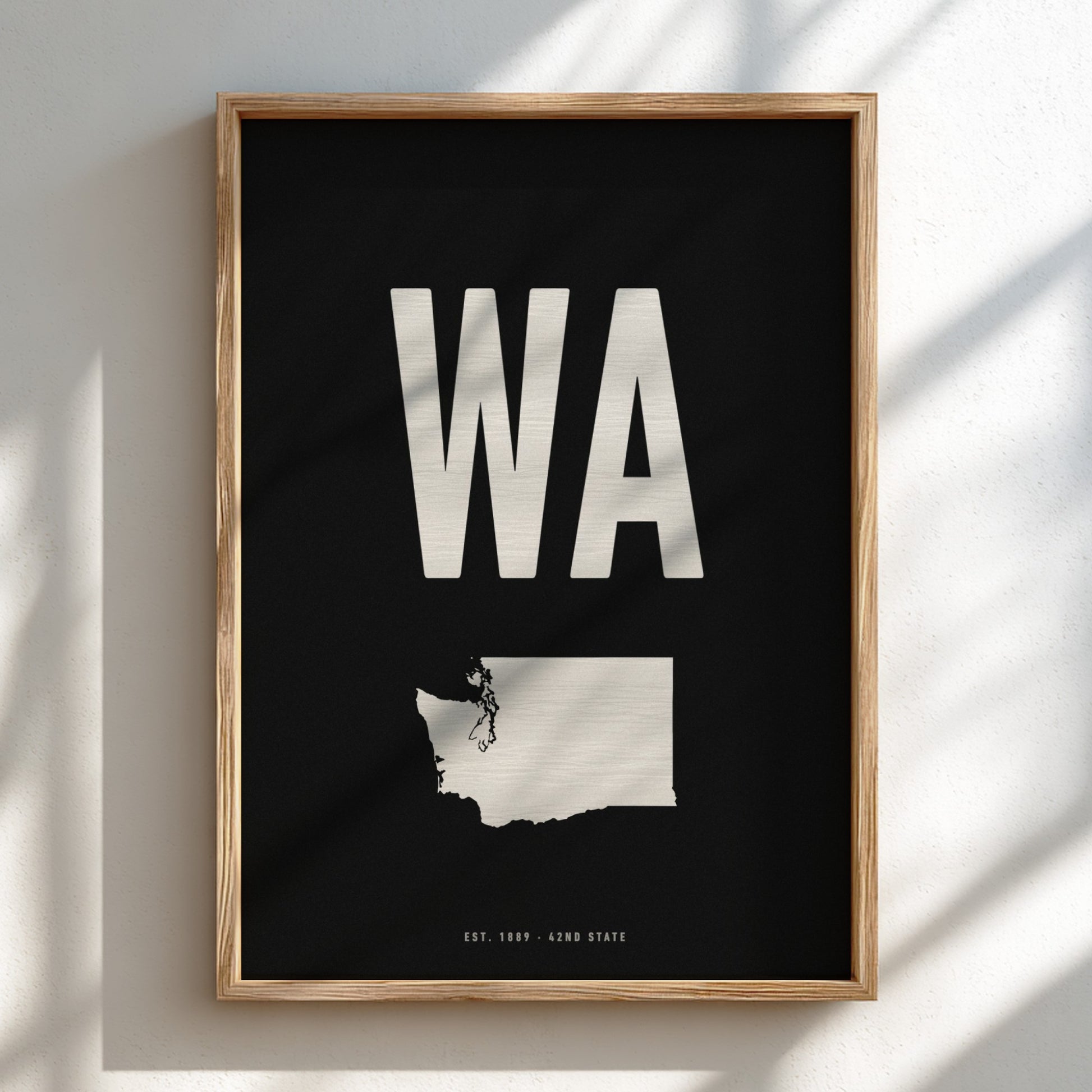 Framed poster with 'WA' and a state outline on a black background