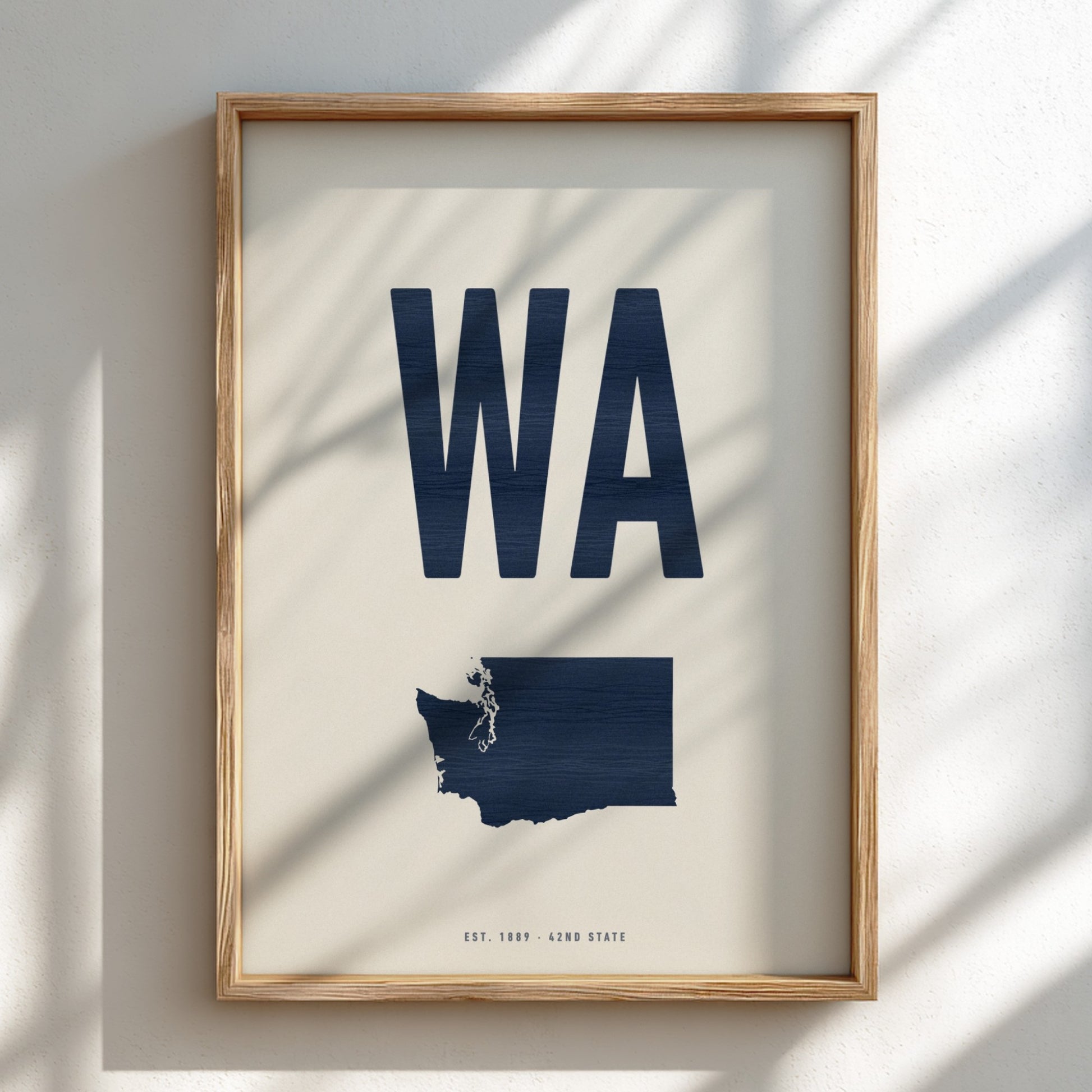 Framed poster with 'WA' and a map of Washington state on a light background