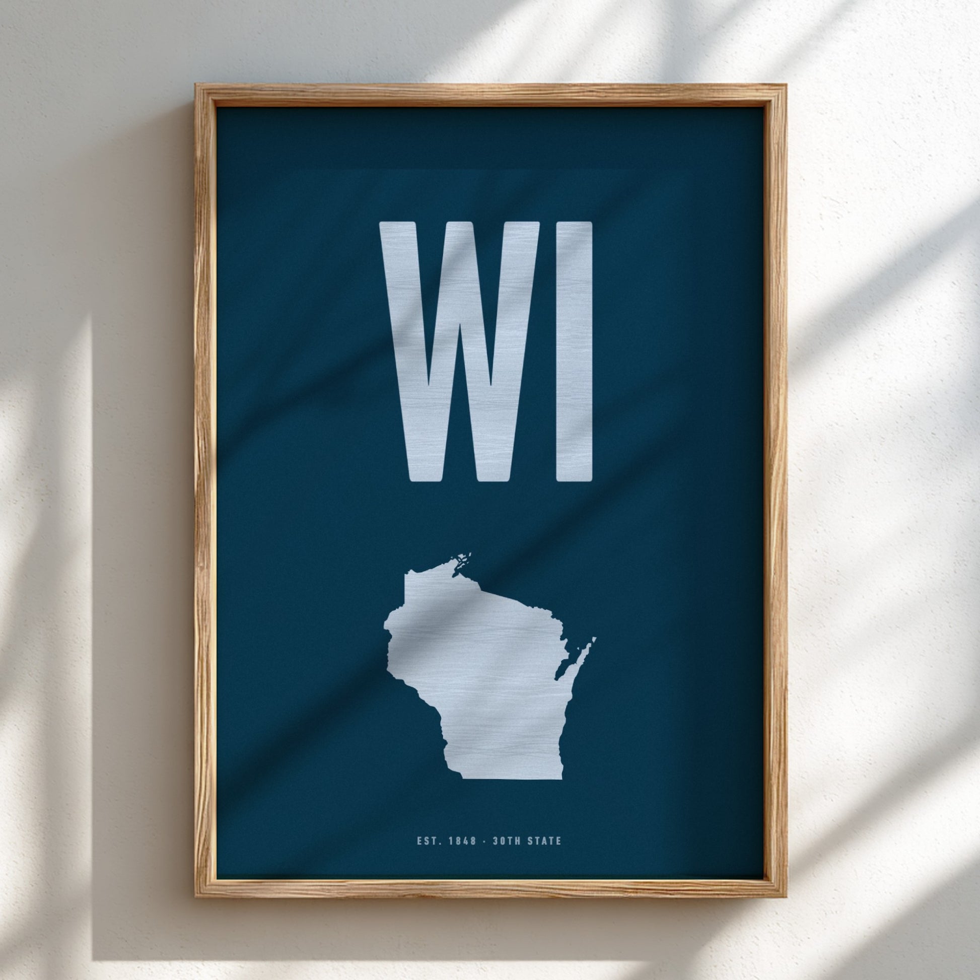 Framed poster of Wisconsin with 'WI' on a blue background