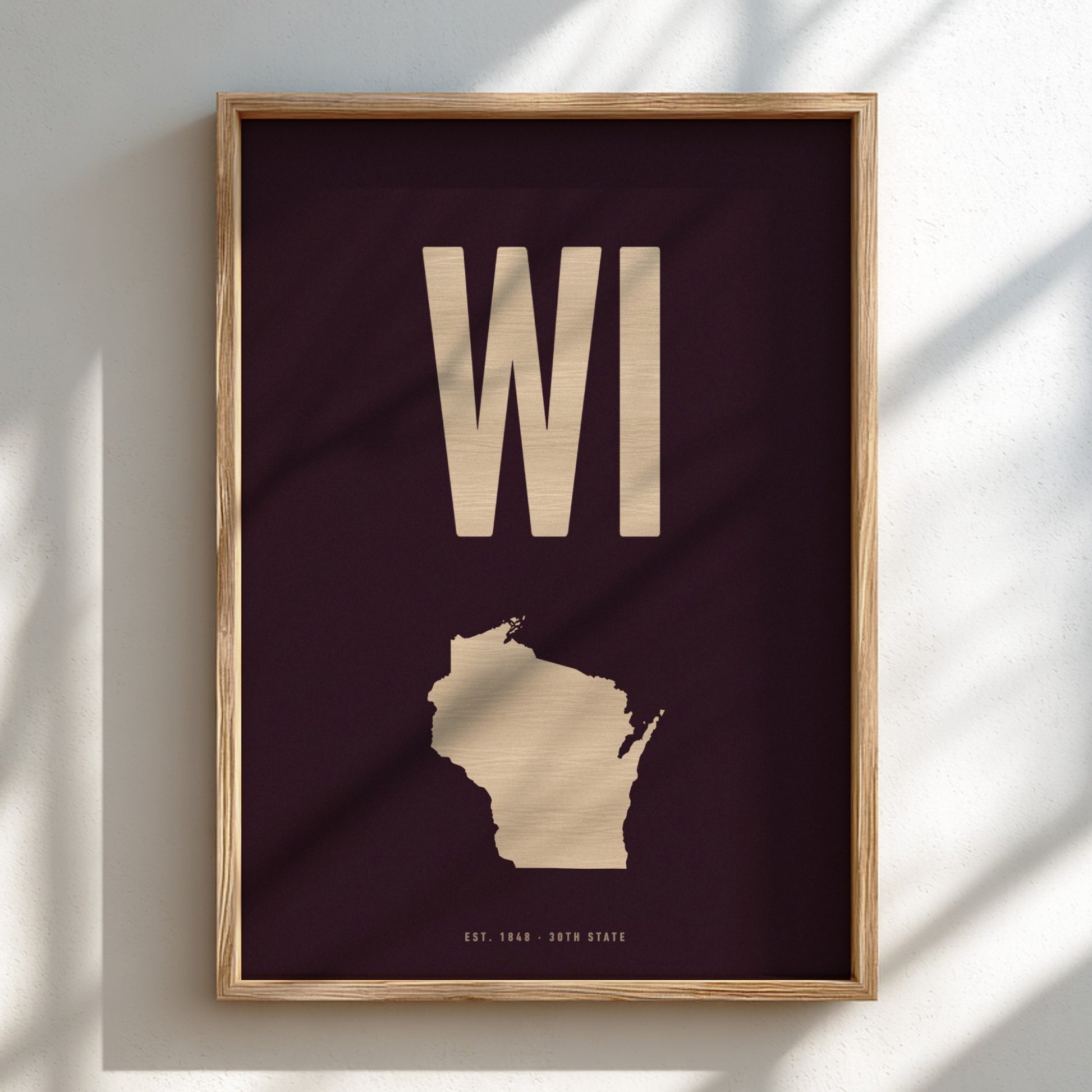 Framed poster of Wisconsin with 'WI' on a dark background