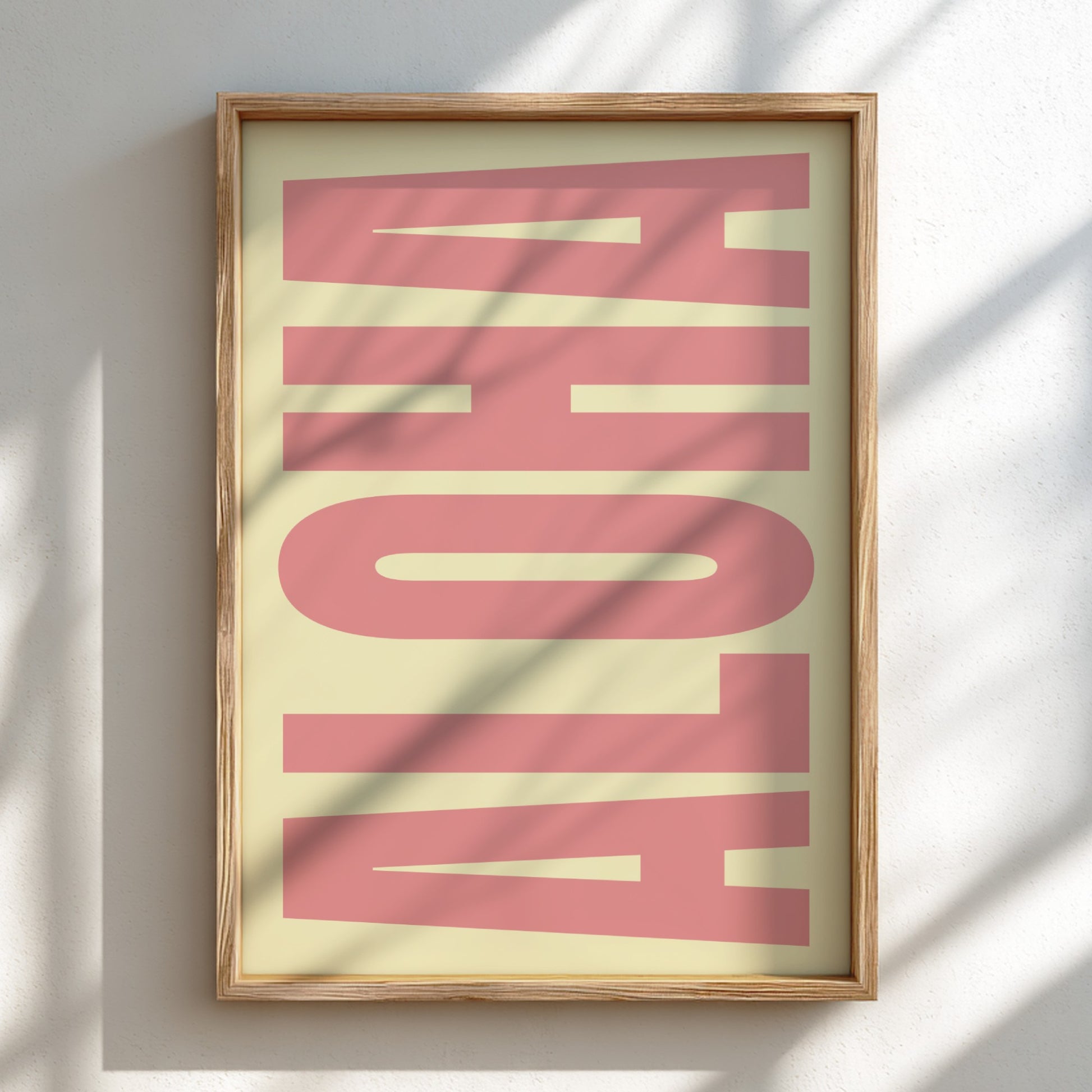 Framed artwork with 'ALOHA' text on a light background