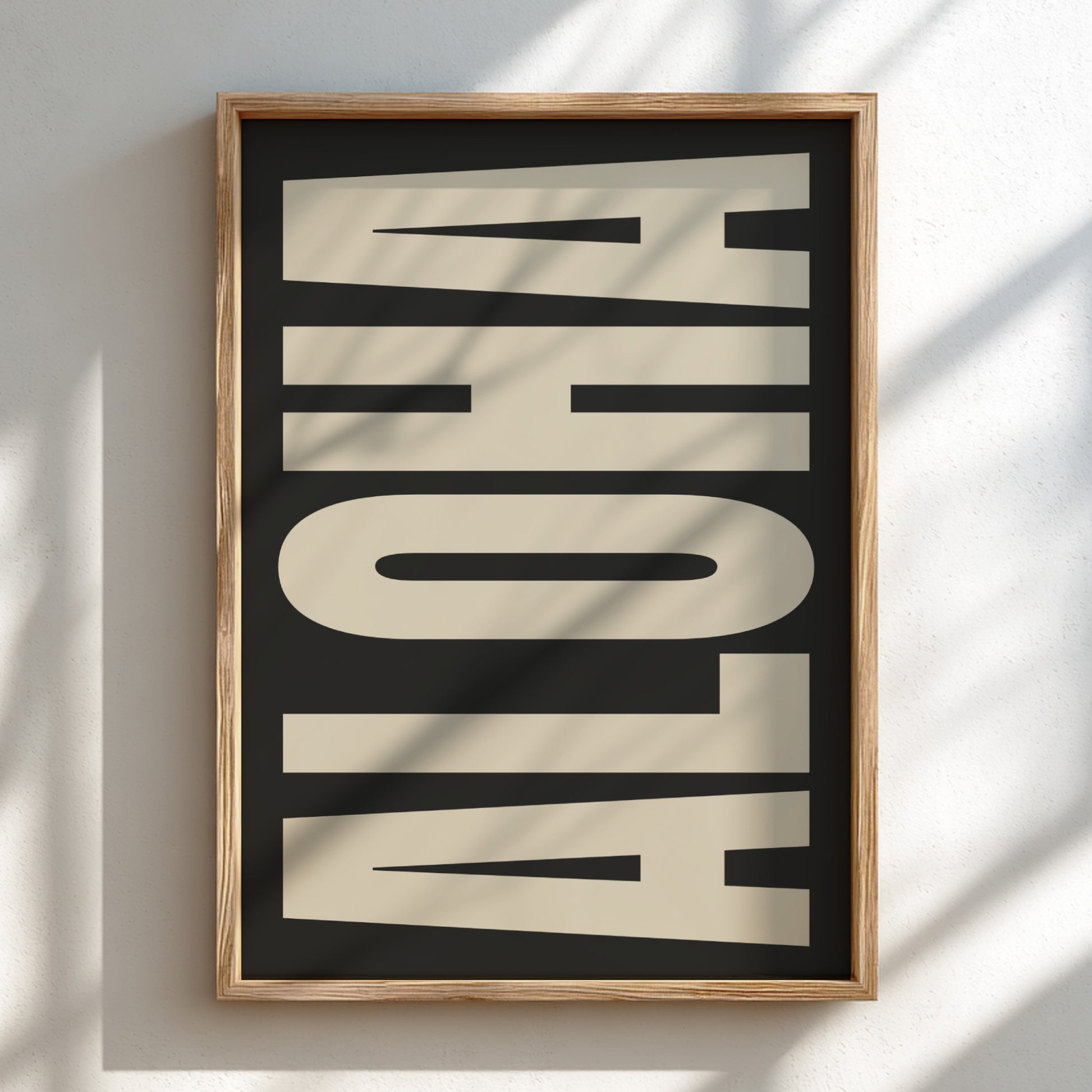 Framed artwork with 'ALOHA' text on a black background
