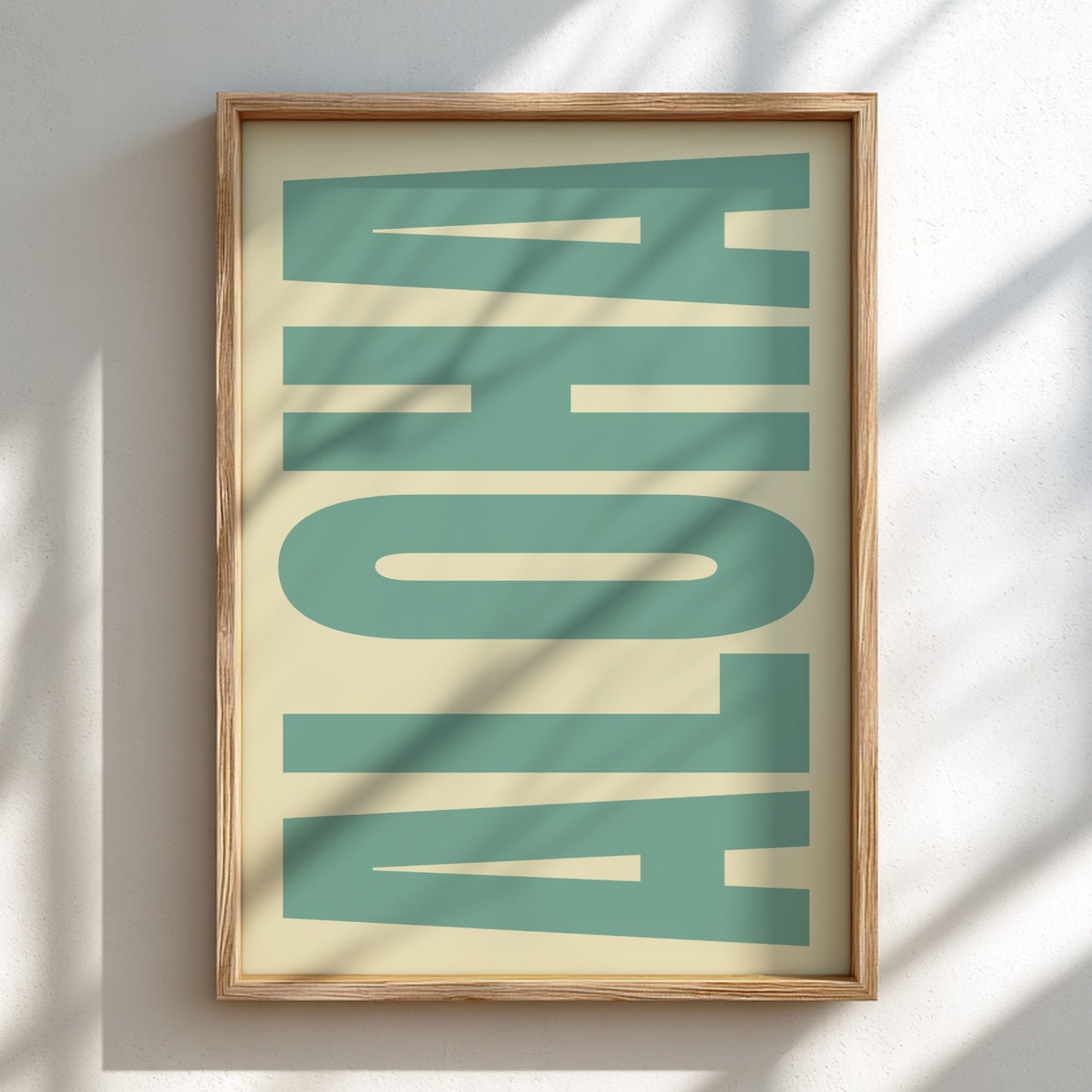 Framed artwork with 'ALOHA' text on a light background