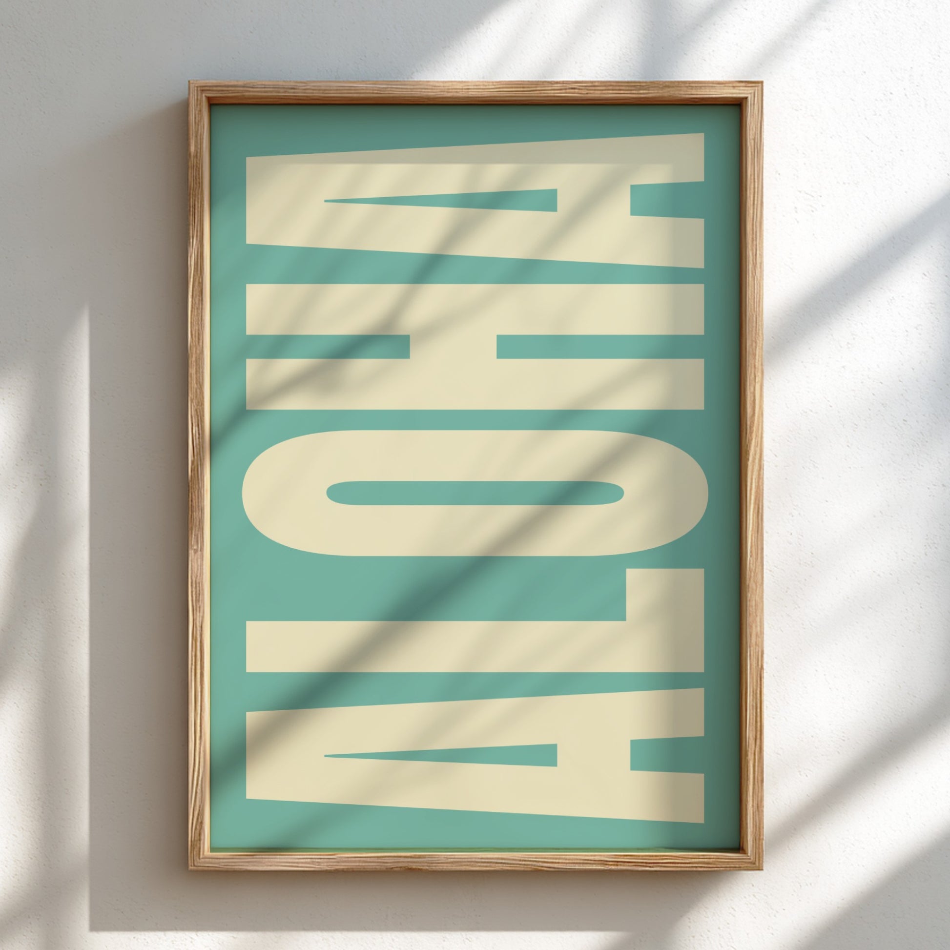 Framed artwork with 'ALOHA' text on a teal background