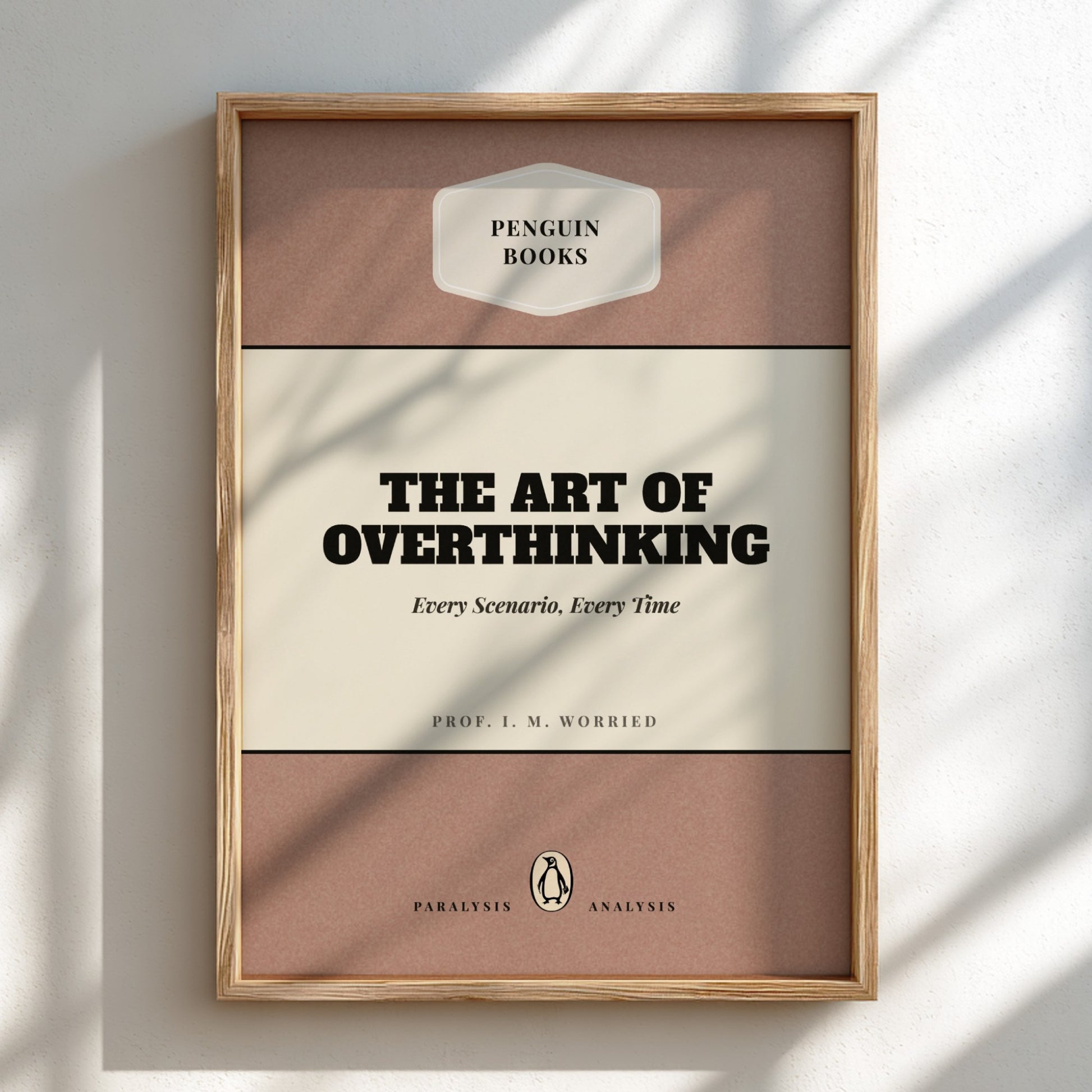 Framed book titled 'The Art of Overthinking' by Penguin Books on a light background