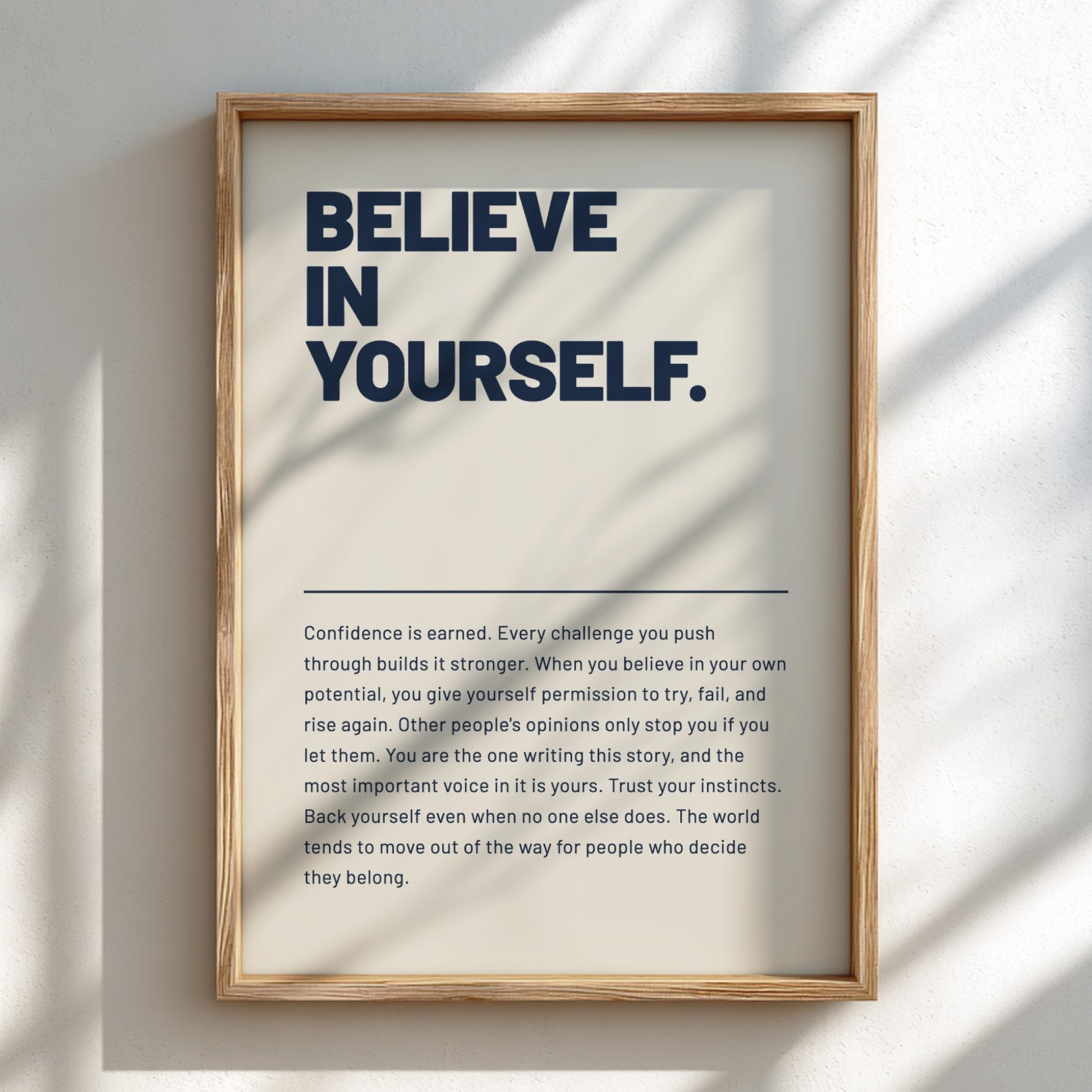 Framed motivational poster with 'BELIEVE IN YOURSELF' text on a light background