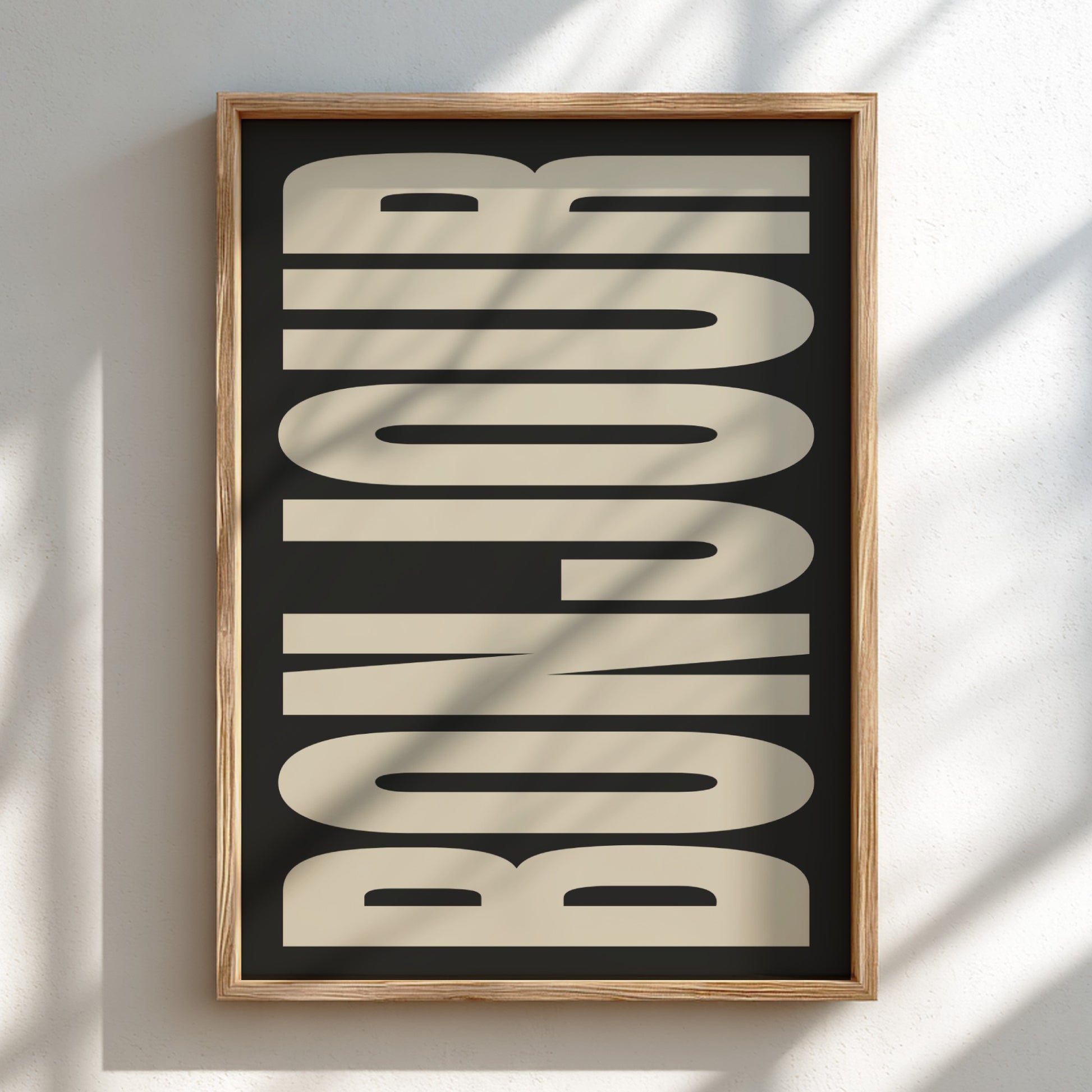 Framed artwork with 'BONJOUR' text on a black background