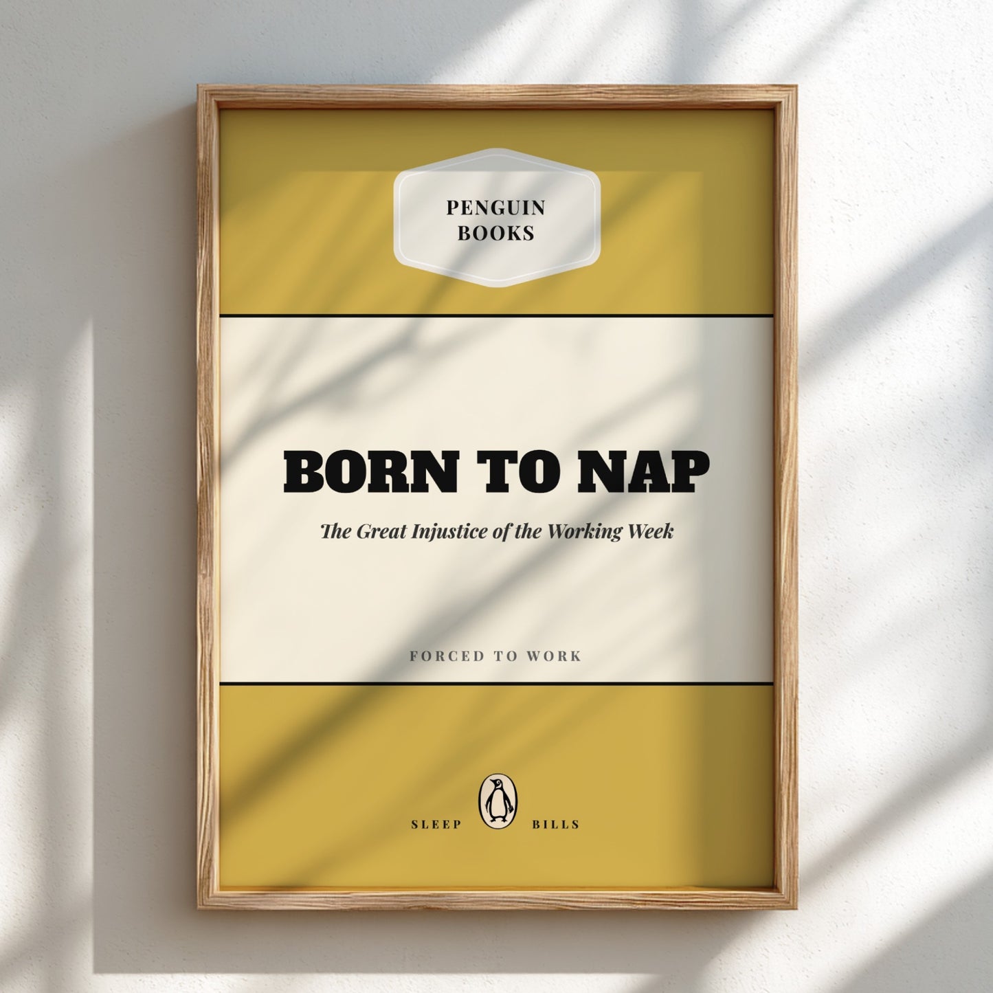 Framed poster with 'Penguin Books' design and text 'Born to Nap' on a light background