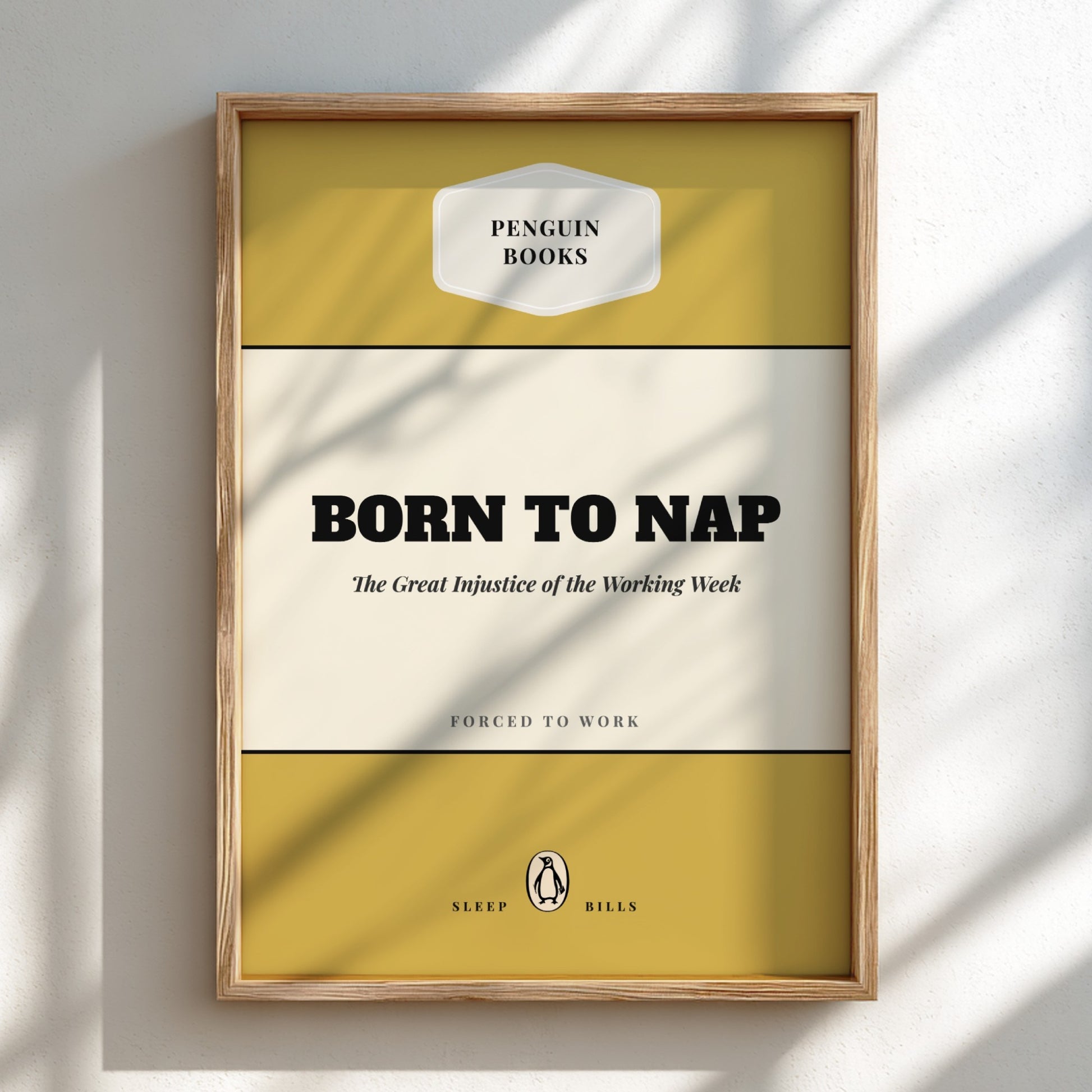Framed poster with 'Penguin Books' design and text 'Born to Nap' on a light background