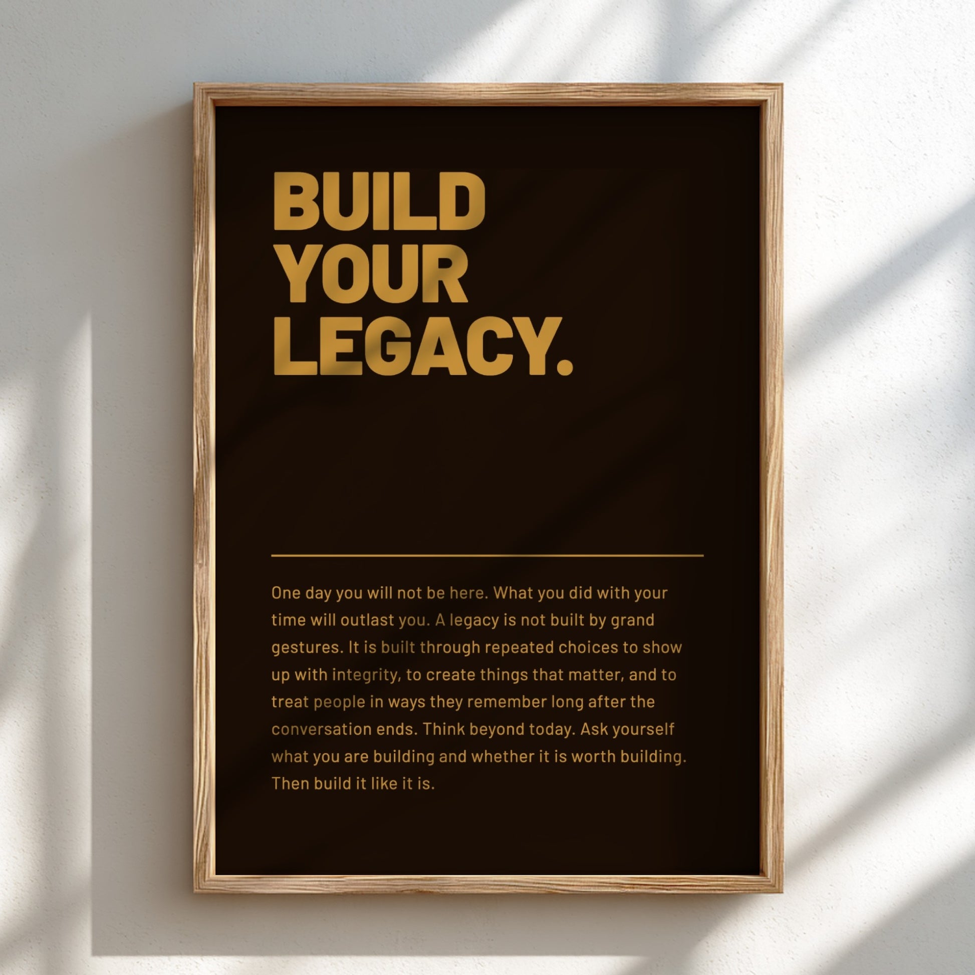 Framed poster with 'Build Your Legacy' text on a dark background