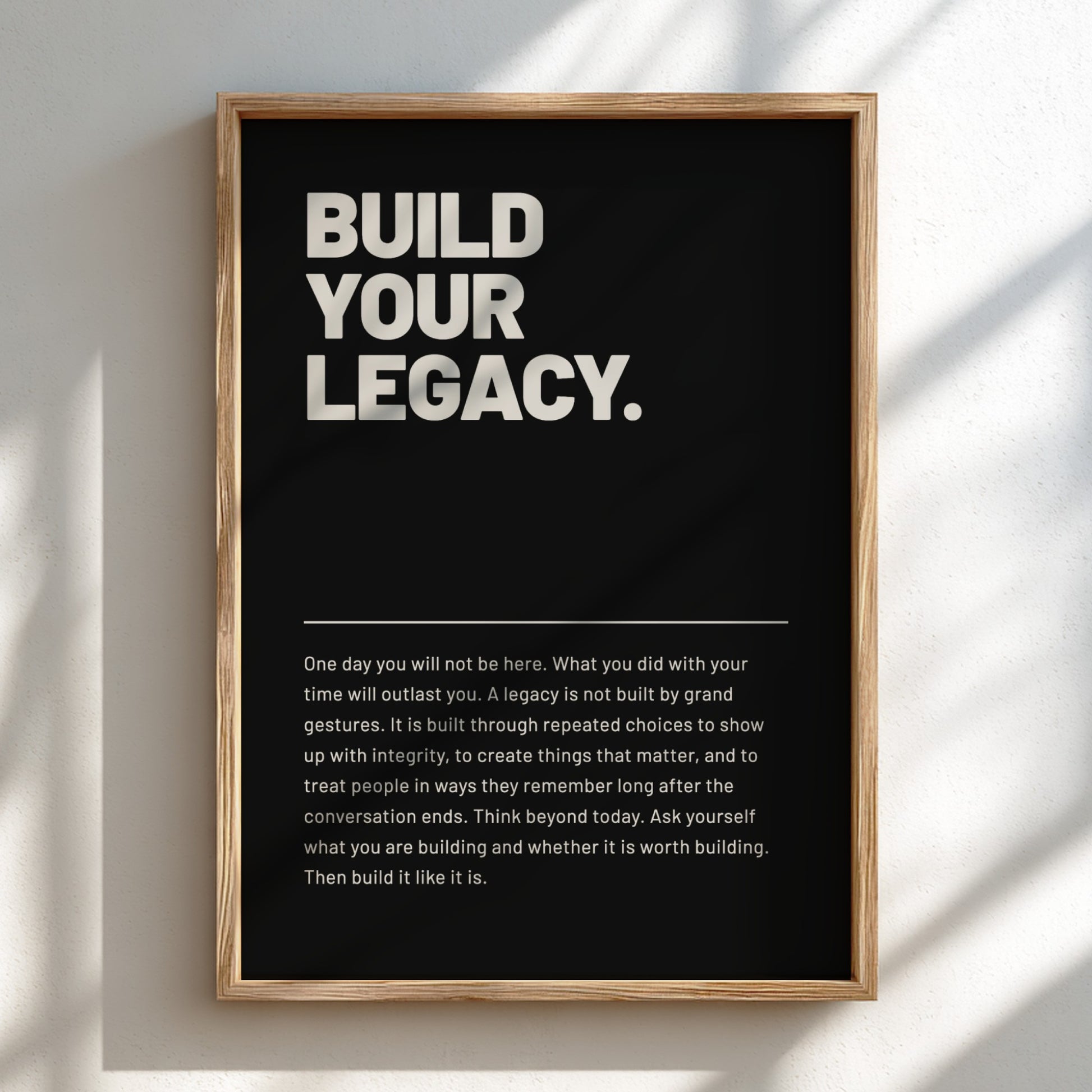 Framed poster with 'Build Your Legacy' text on a black background