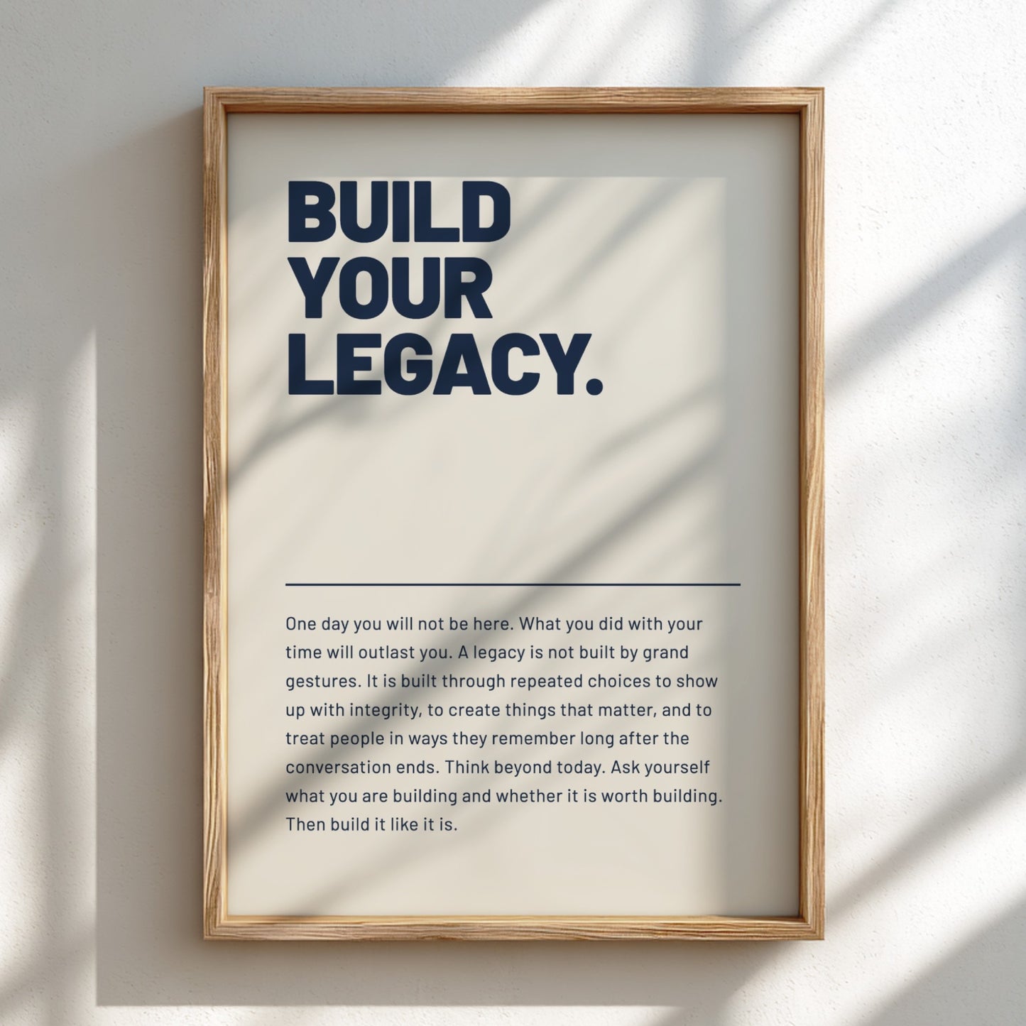 Framed poster with motivational quote 'Build Your Legacy' on a light background