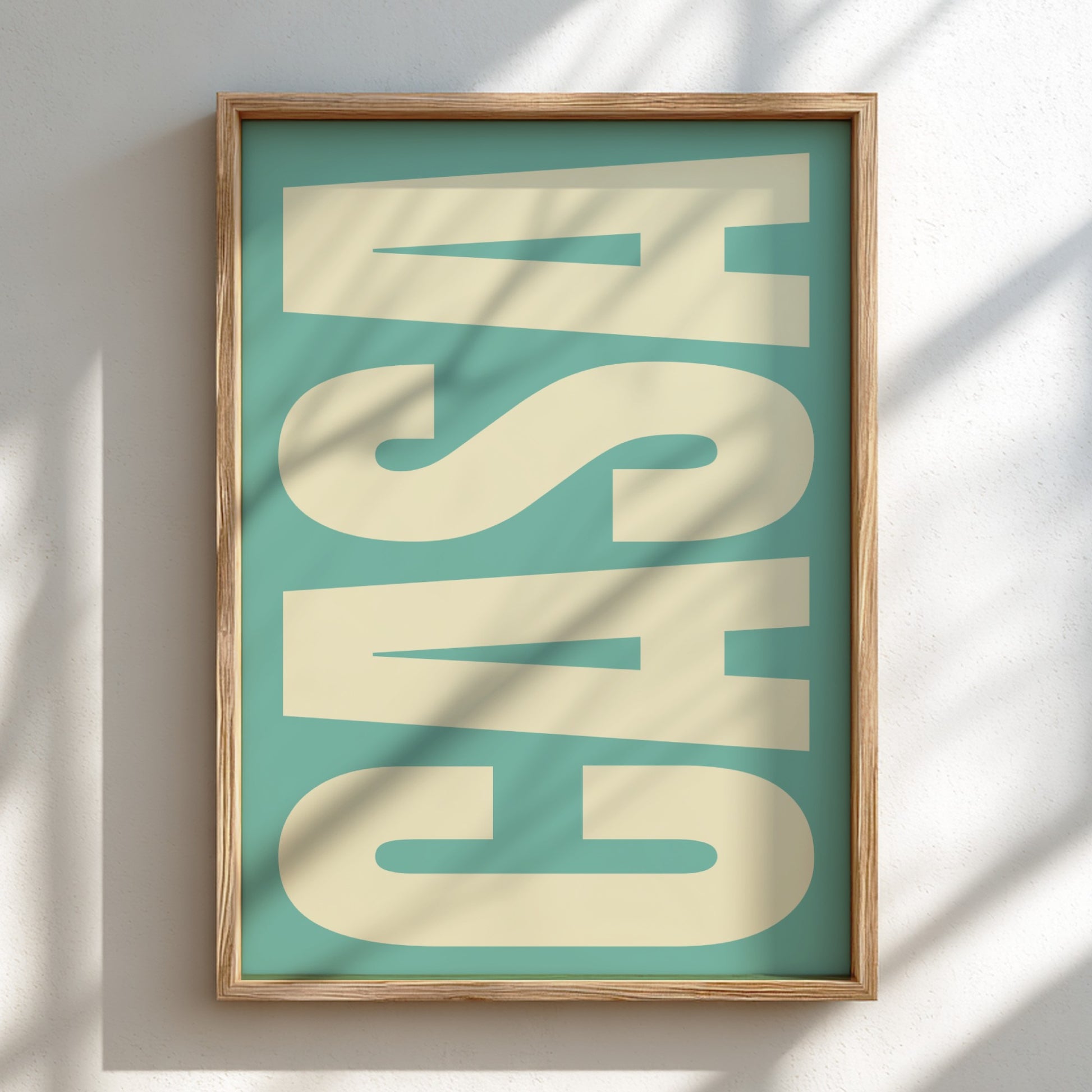 Framed artwork with 'CASA' text on a teal background