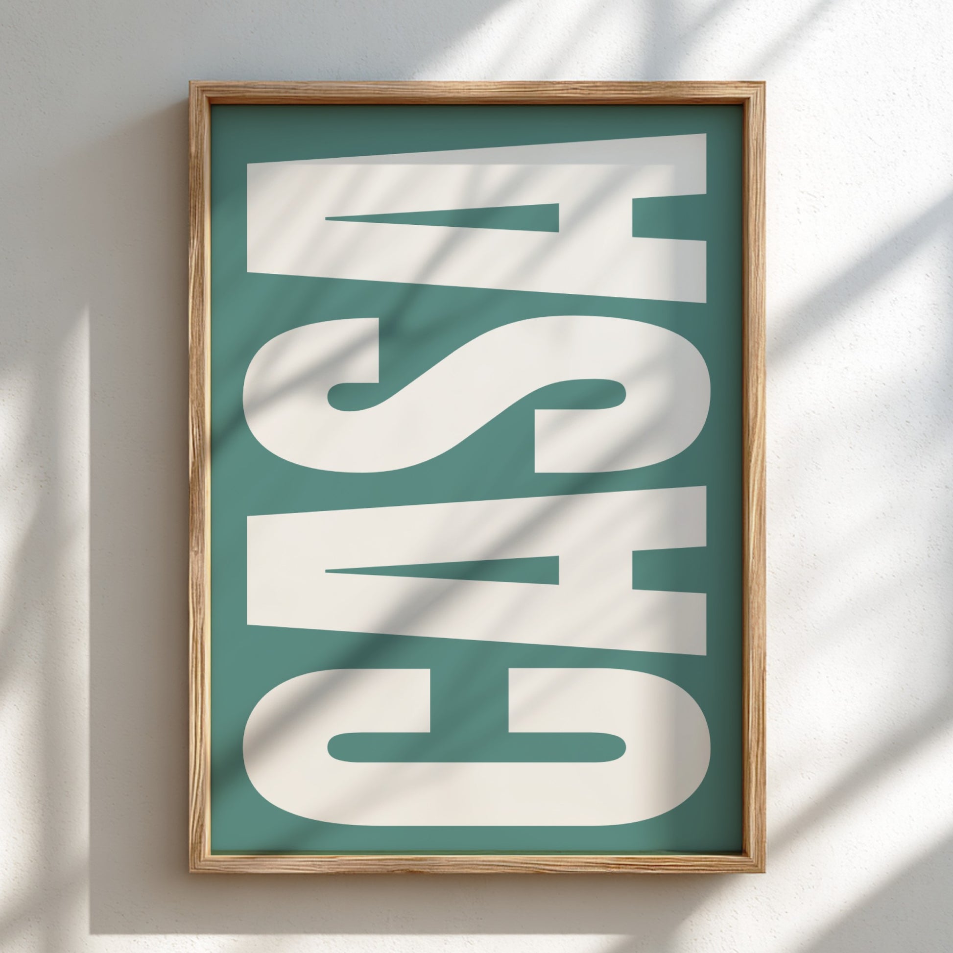 Framed artwork with 'CASA' text on a teal background