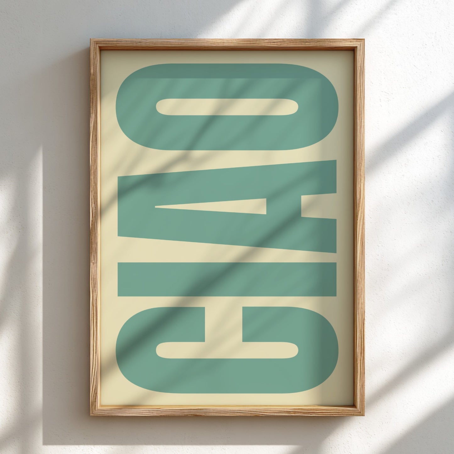 Framed artwork with the word 'Ciao' in a stylized font on a light background