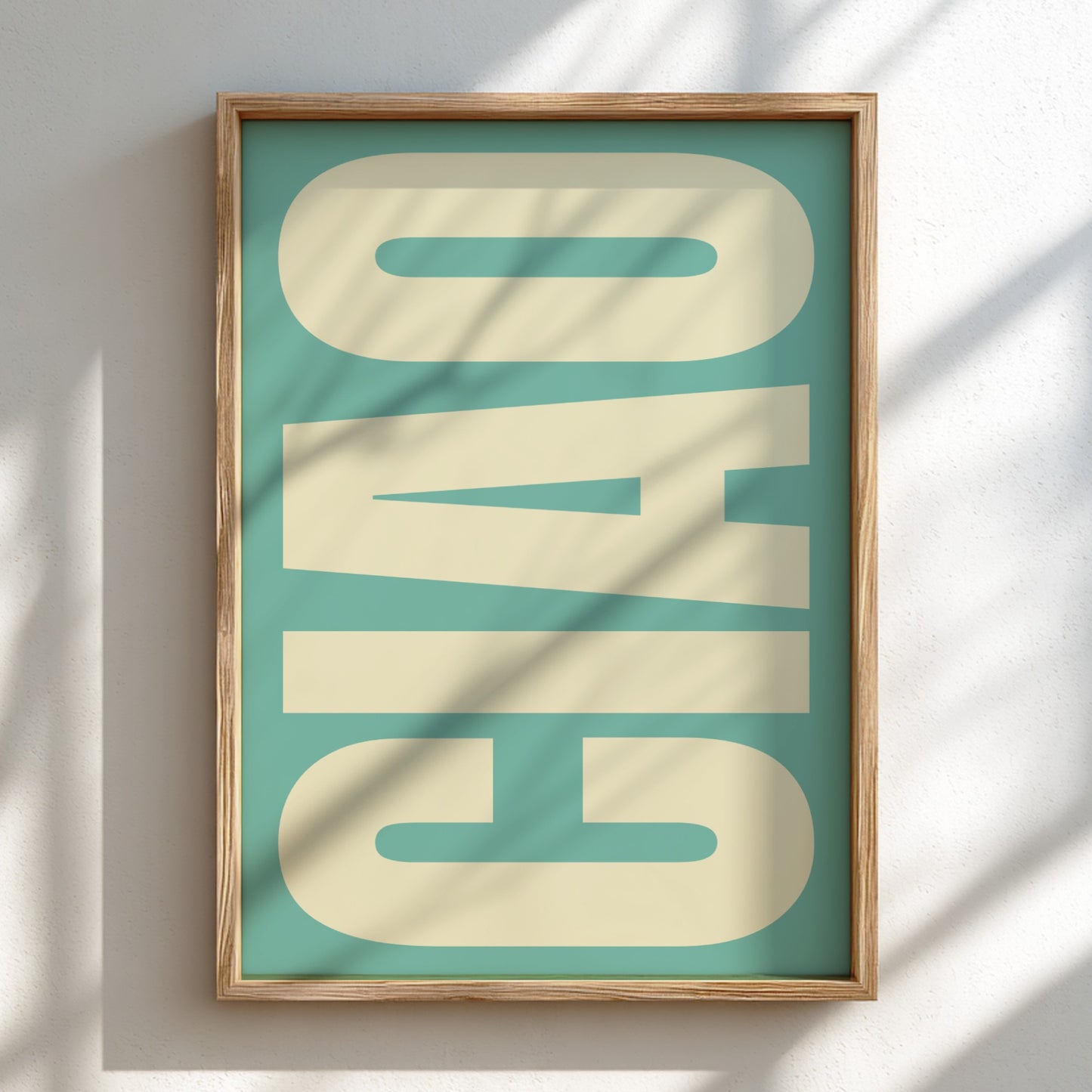 Framed artwork with 'Ciao' text on a teal background