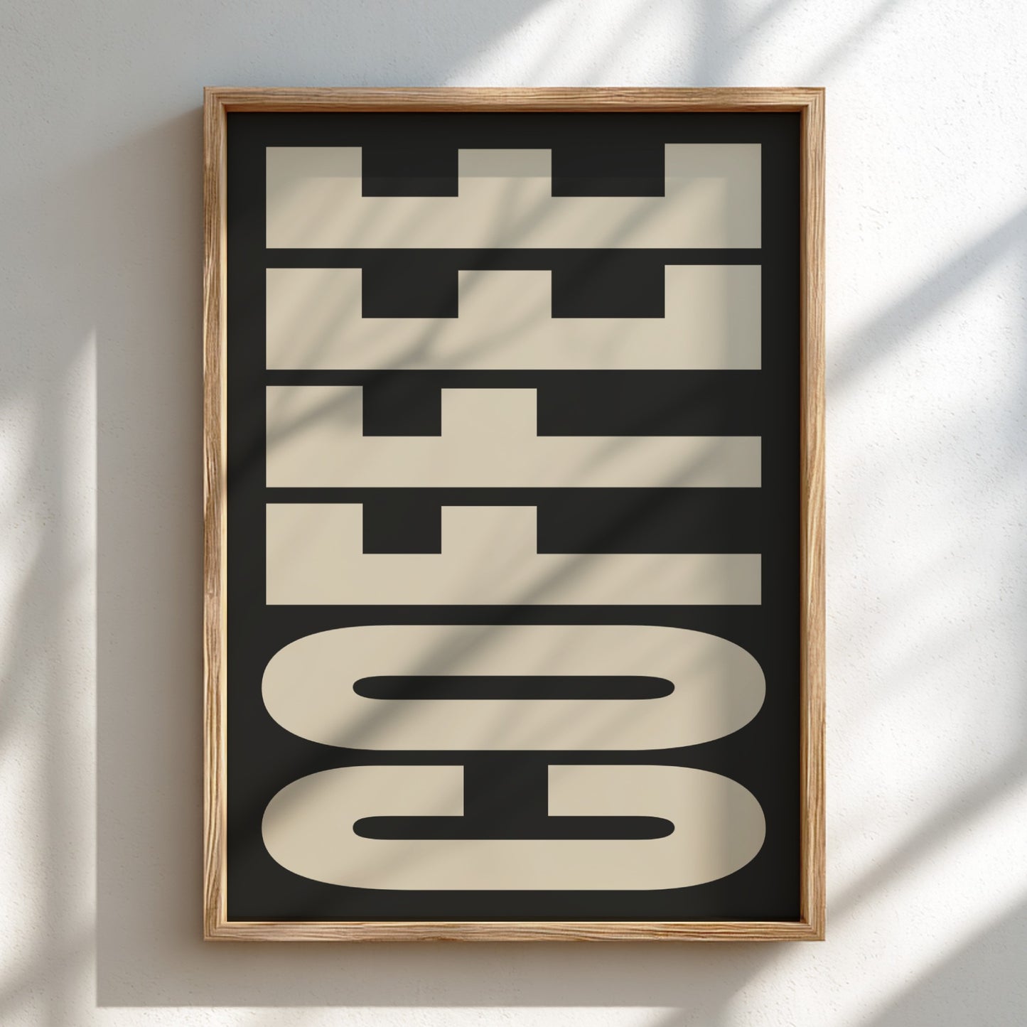 Framed artwork with 'COFFEE' text on a black background