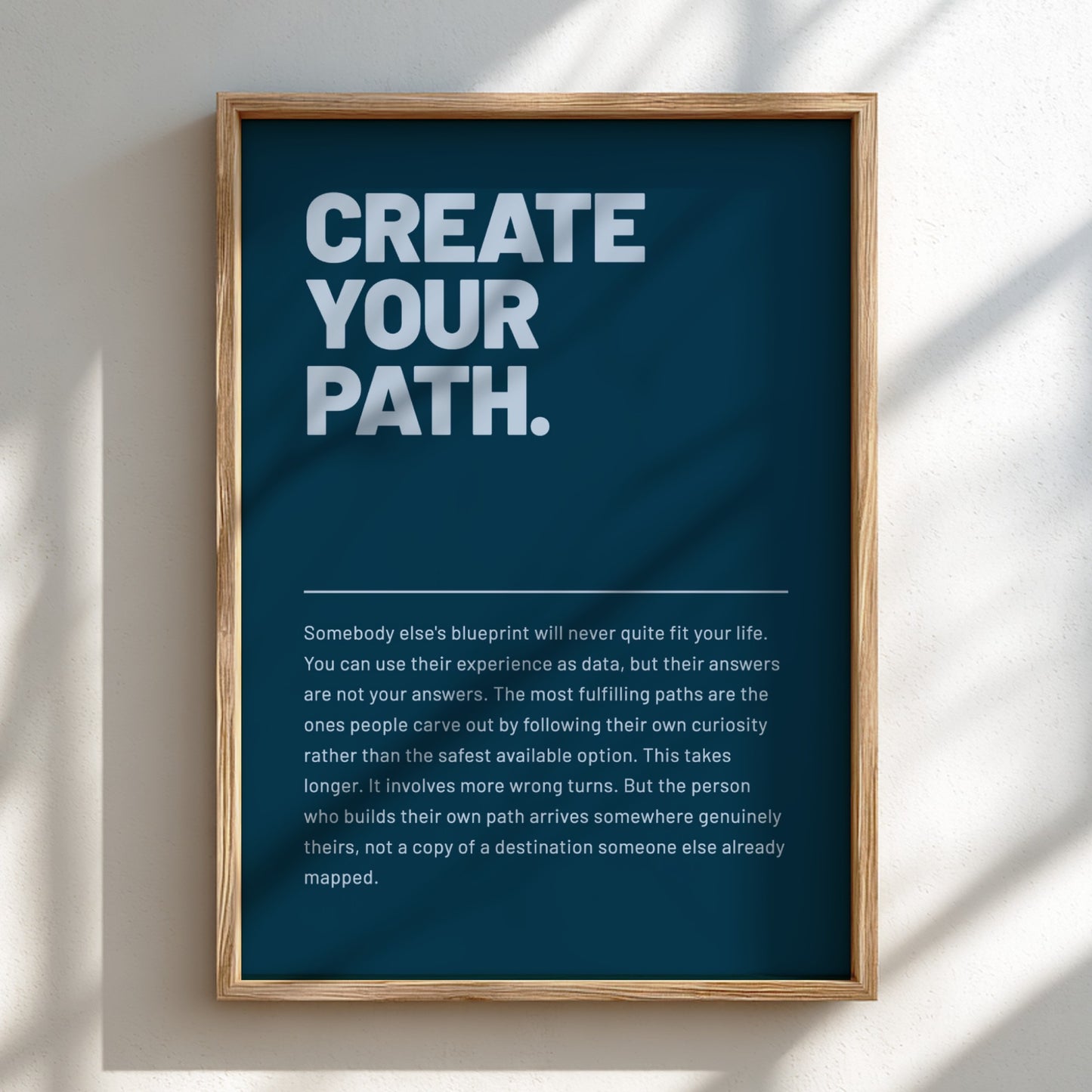 Framed poster with motivational quote 'Create Your Path' on a blue background