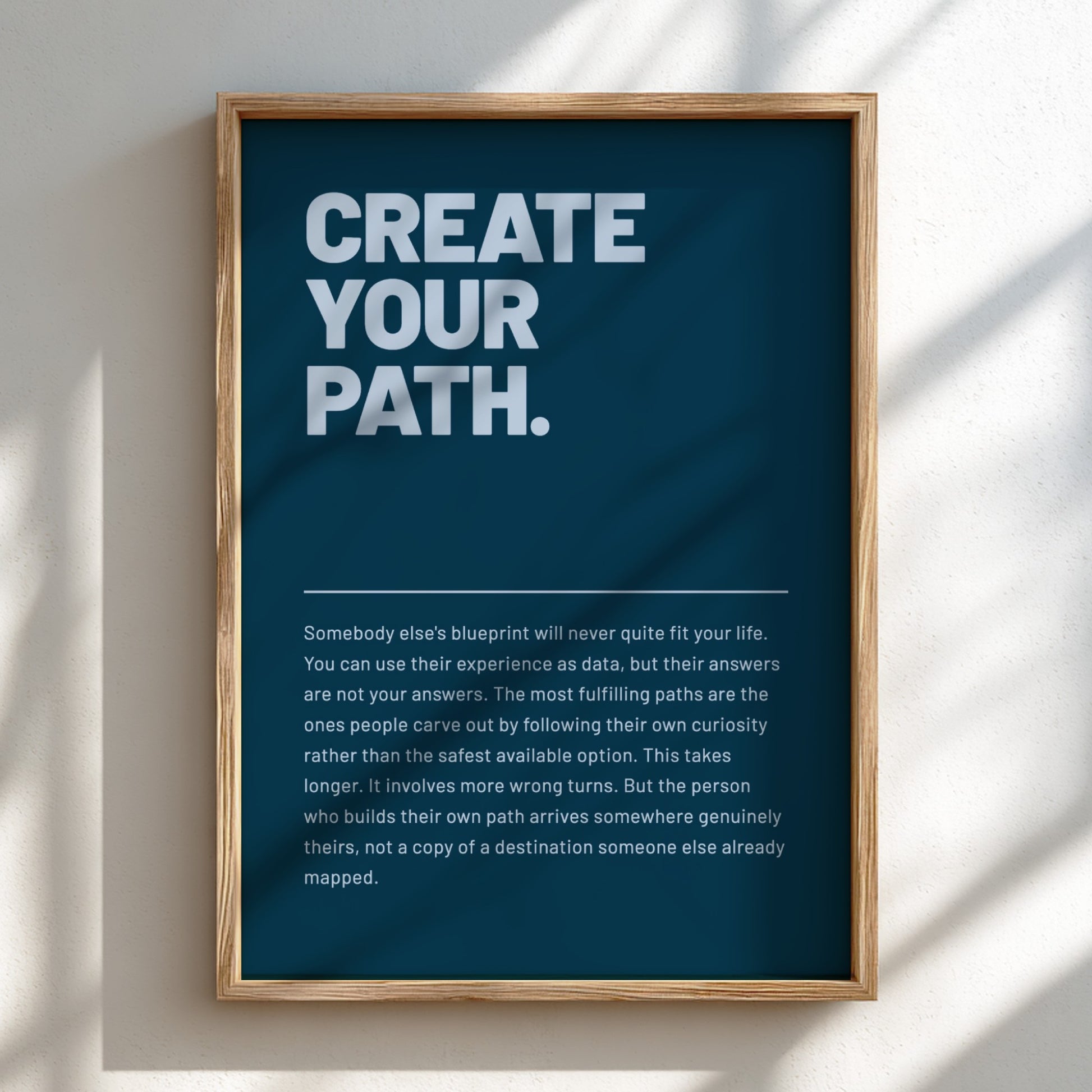 Framed poster with motivational quote 'Create Your Path' on a blue background