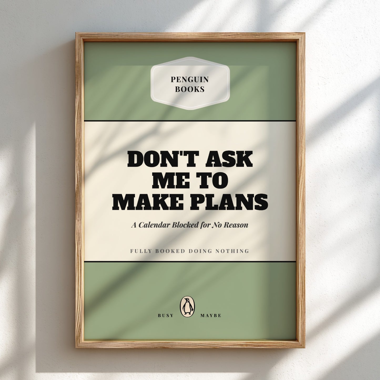 Framed poster with 'Penguin Books' design and text 'Don't ask me to make plans'.