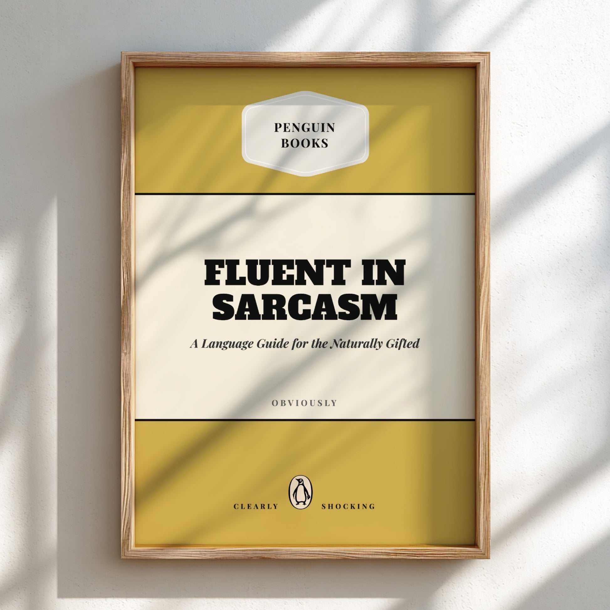 Framed book cover of 'Fluent in Sarcasm' by Penguin Books on a light background