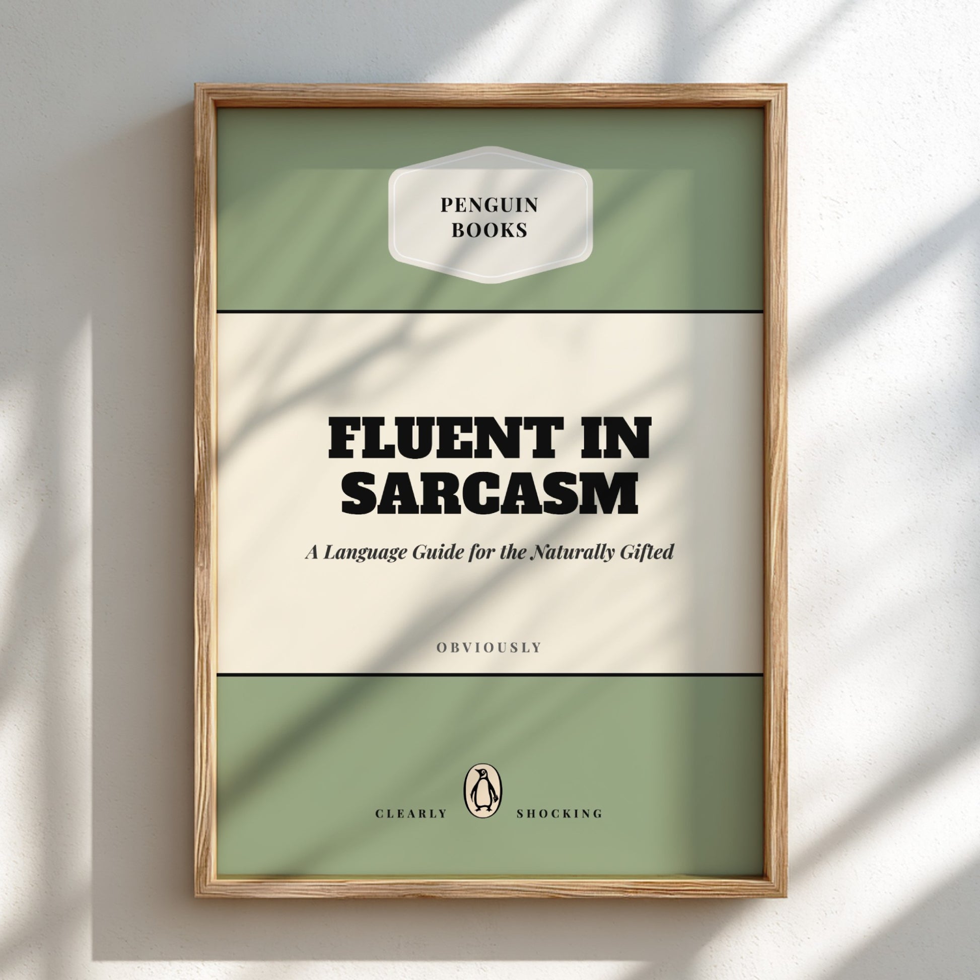 Framed book cover of 'Fluent in Sarcasm' by Penguin Books on a light background