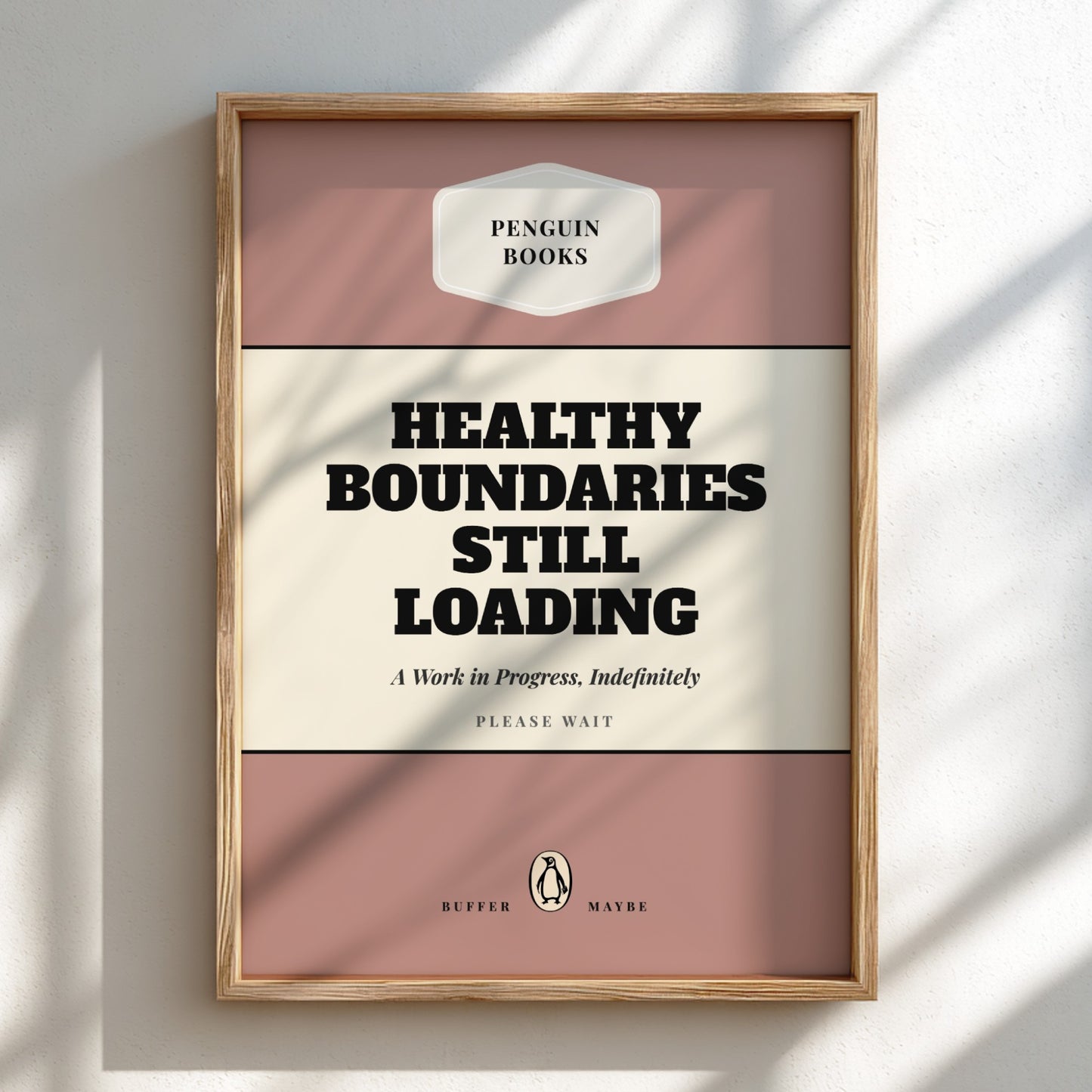 Framed poster with 'Healthy Boundaries Still Loading' text on a pink and beige background.