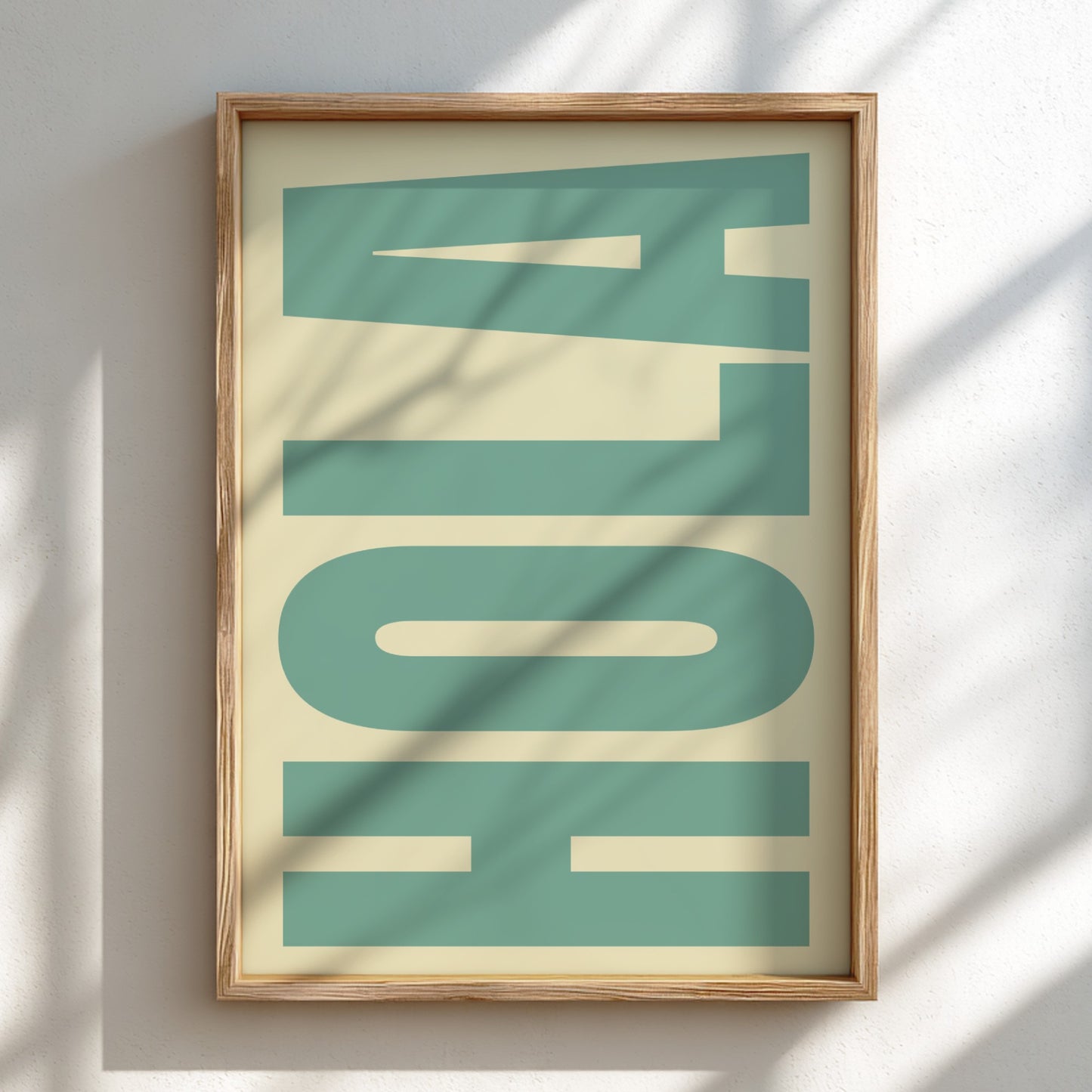 Framed artwork with 'HOLA' text on a light background