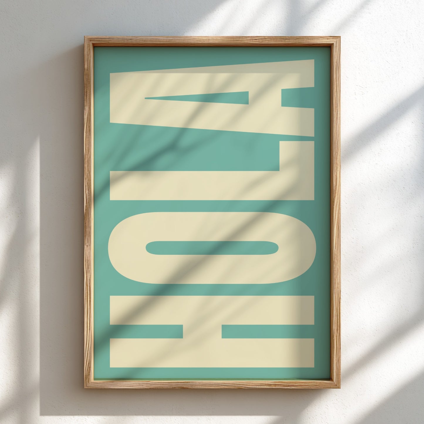 Framed artwork with 'HOLA' text on a teal background