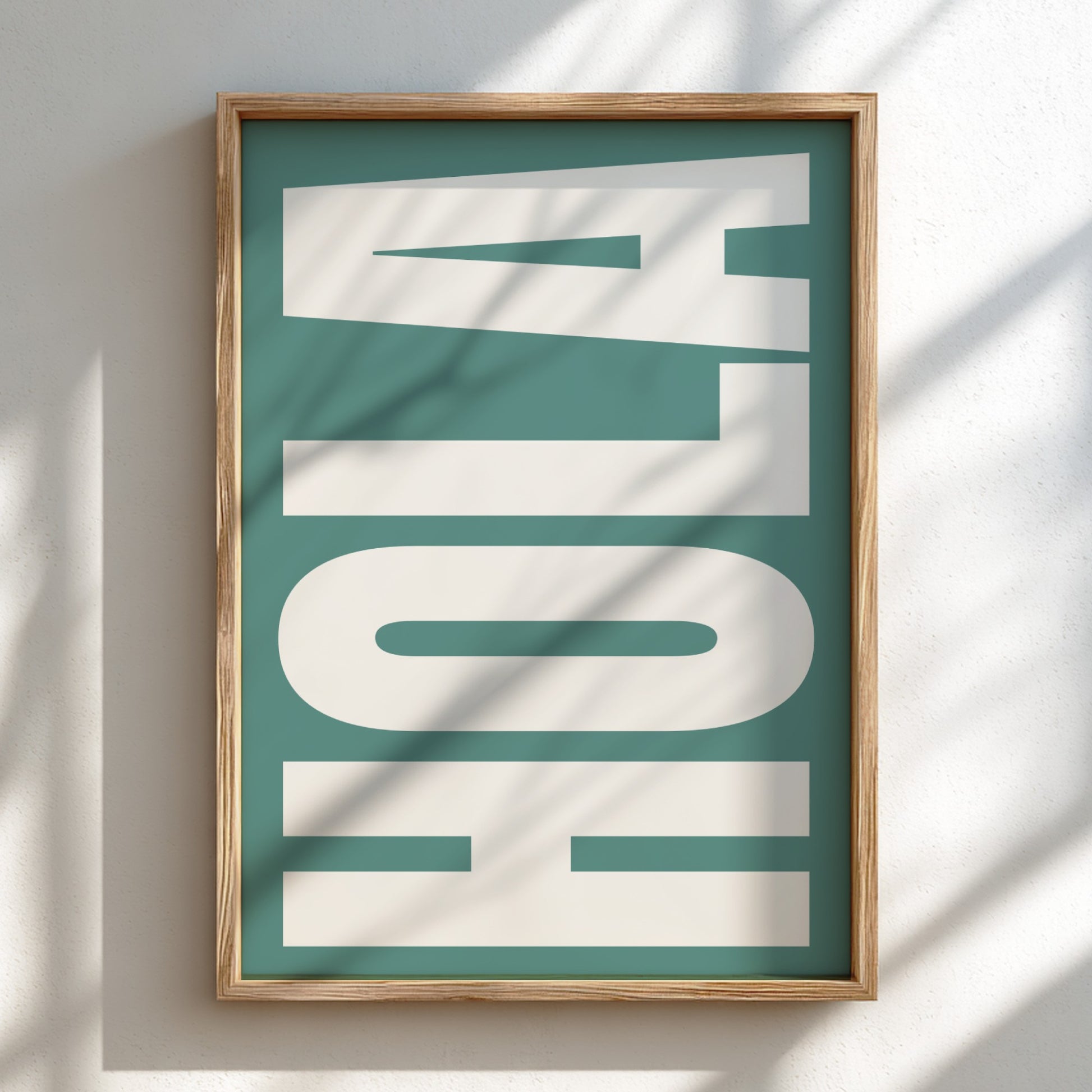 Framed artwork with 'Hola' text on a teal background