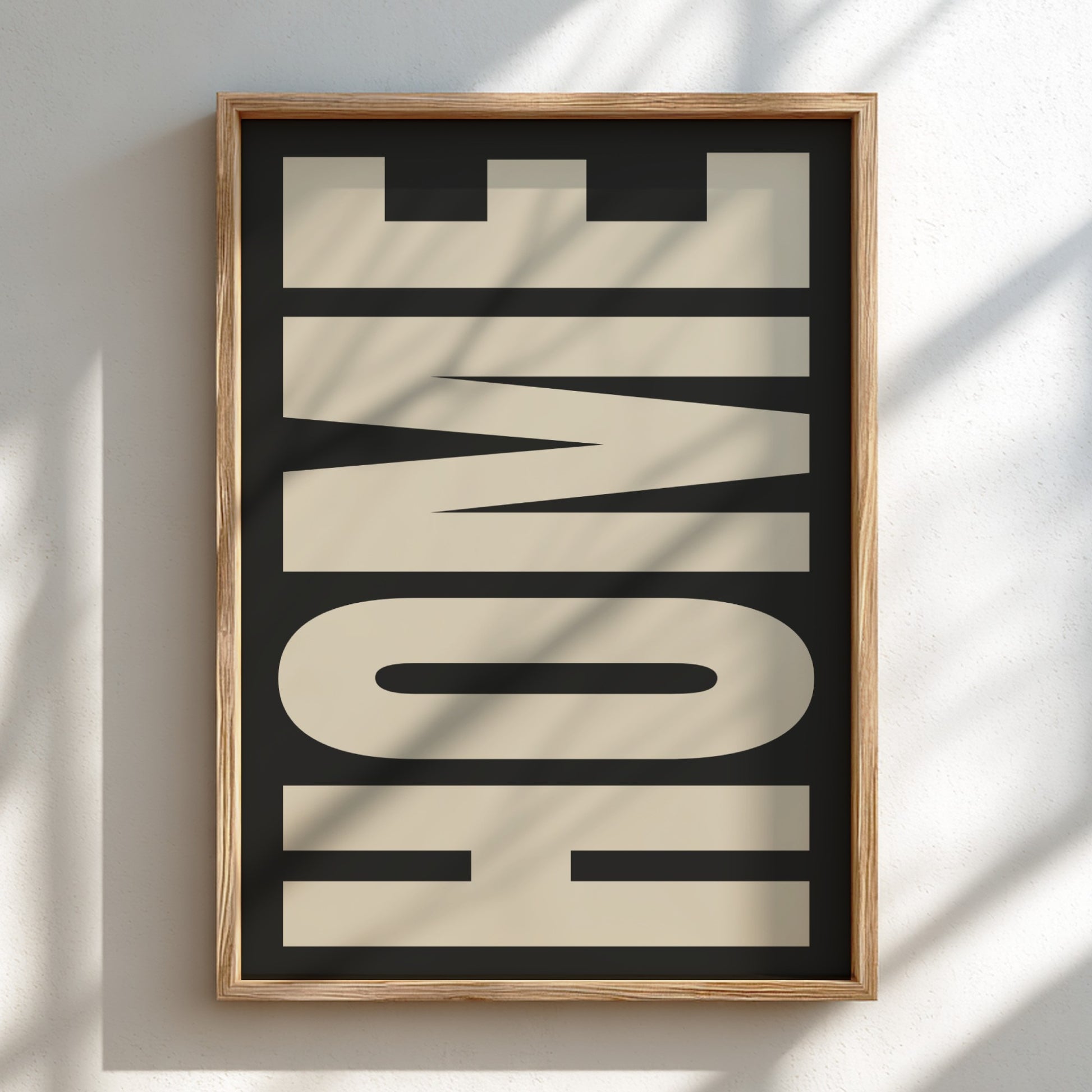 Framed artwork with the word 'HOME' on a light background