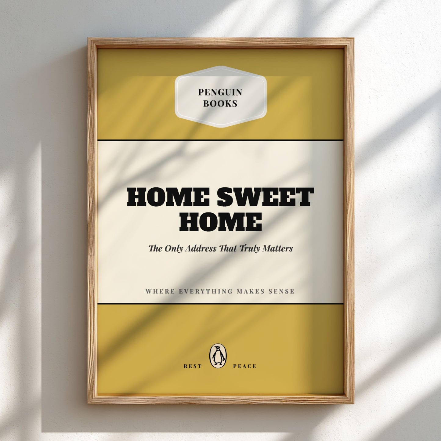 Framed Penguin Books 'Home Sweet Home' book cover on a light background