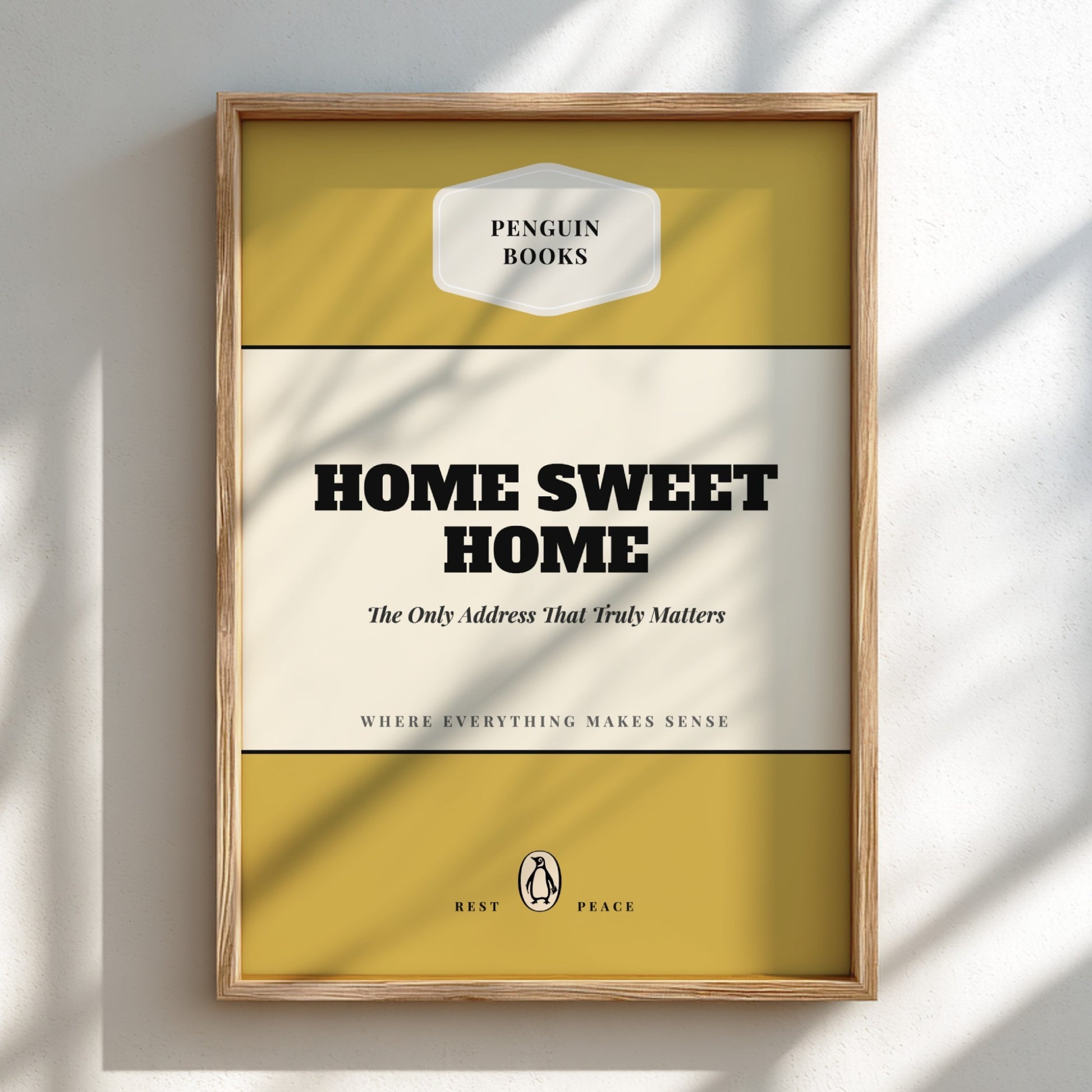 Framed Penguin Books 'Home Sweet Home' book cover on a light background