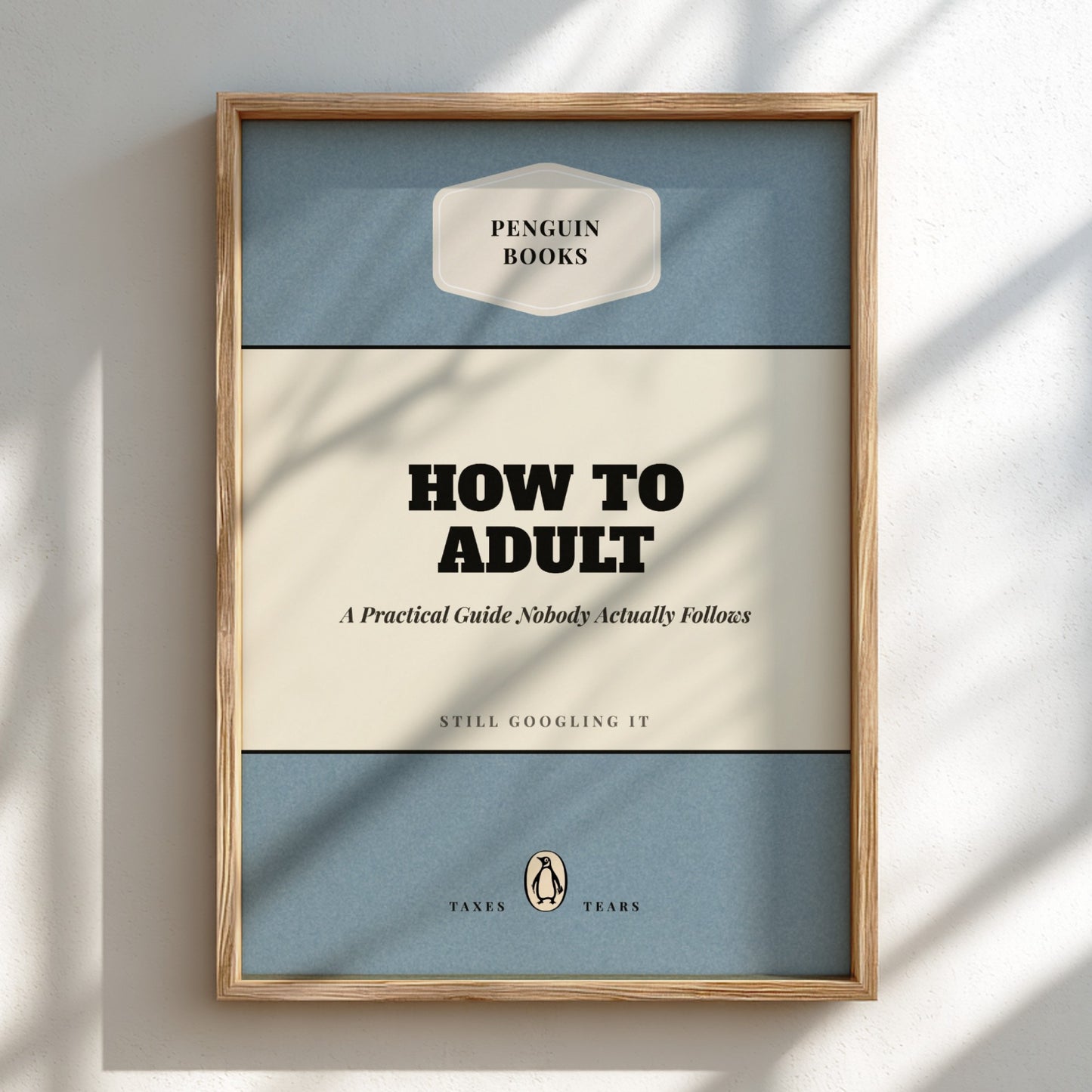 Framed book cover of 'How to Adult' by Penguin Books on a light background