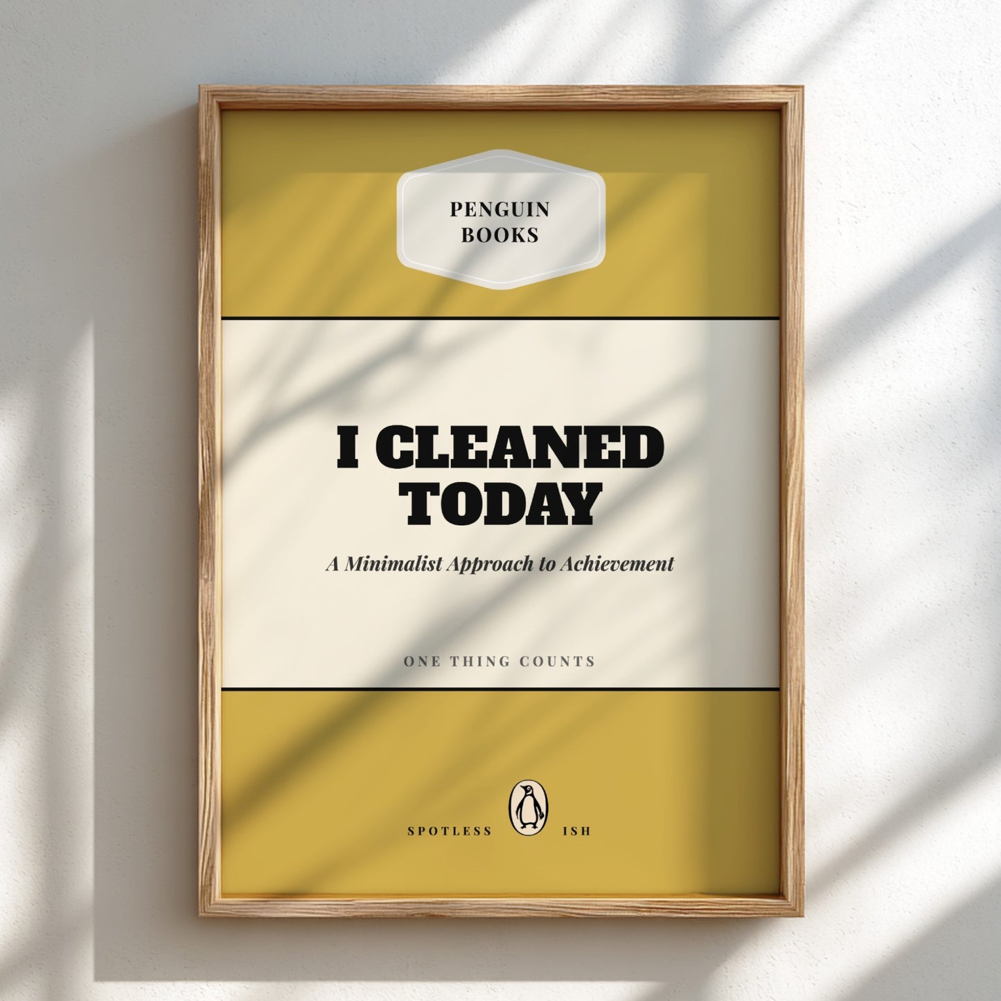 Framed poster with 'Penguin Books' design and text 'I Cleaned Today' on a light background