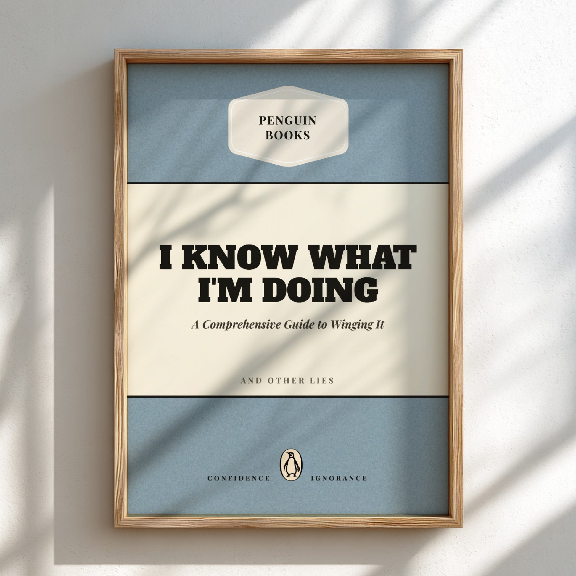 Framed Penguin Books poster with text 'I Know What I'm Doing' on a light background