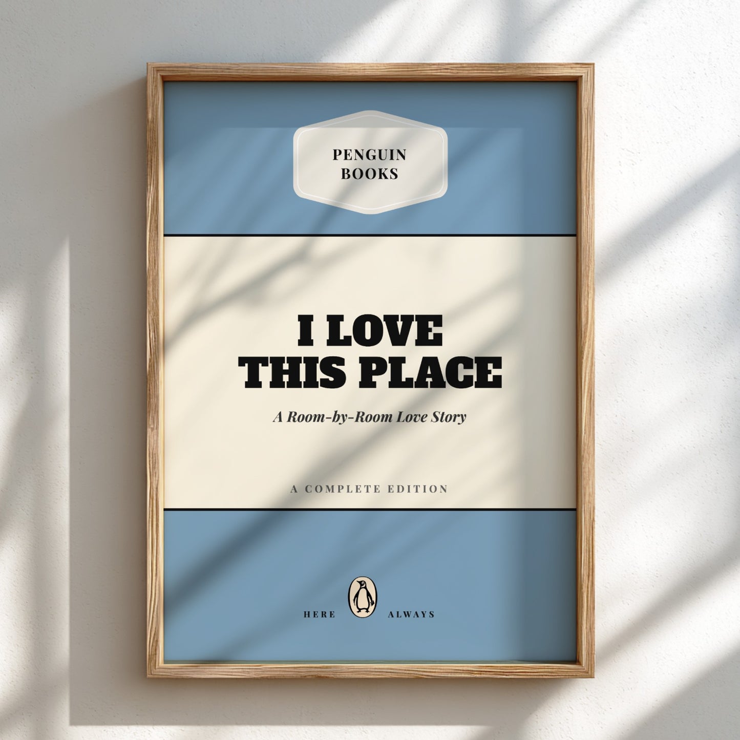 Framed book cover with 'Penguin Books' branding and text 'I Love This Place'.