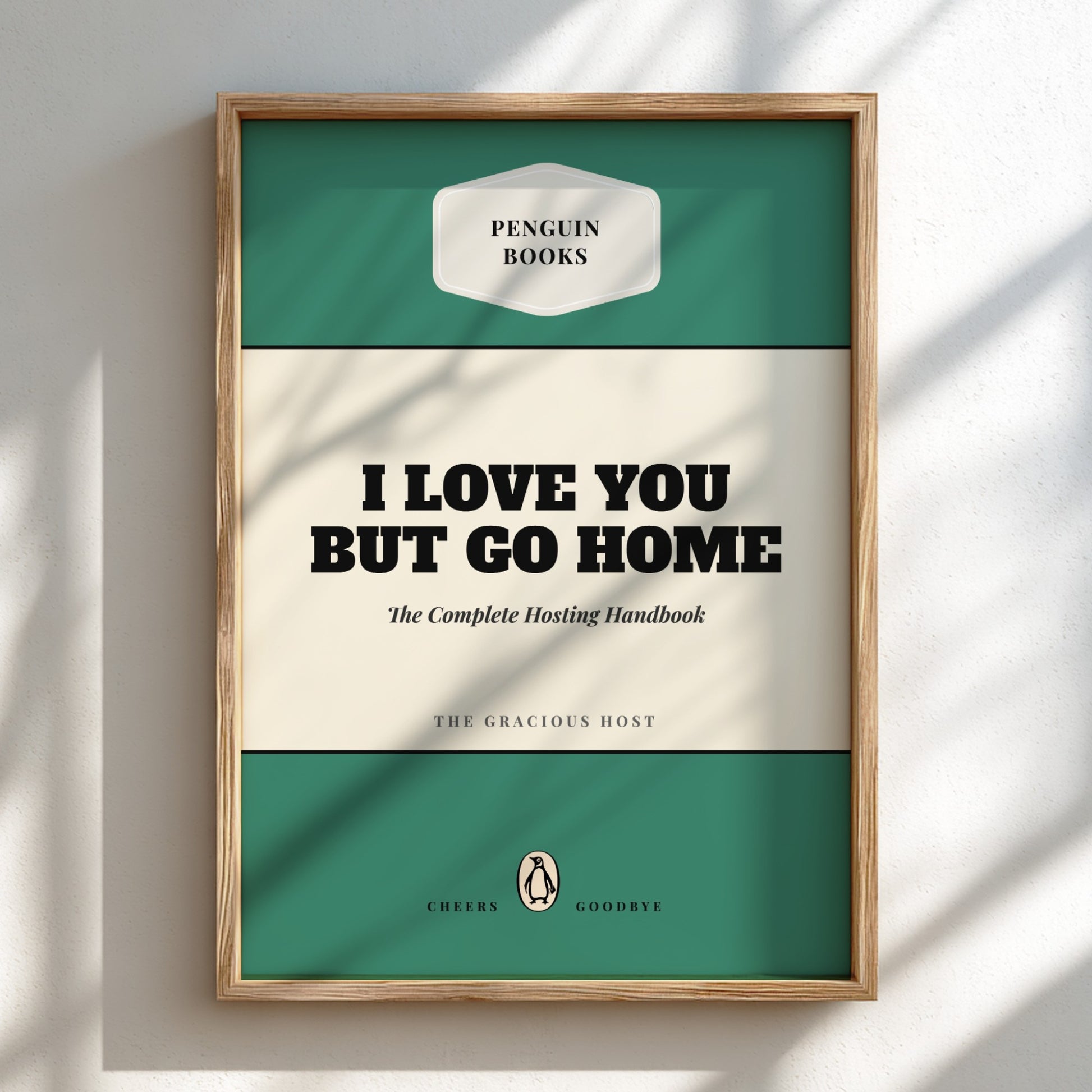 Framed book cover with 'Penguin Books' branding and text 'I Love You But Go Home'.
