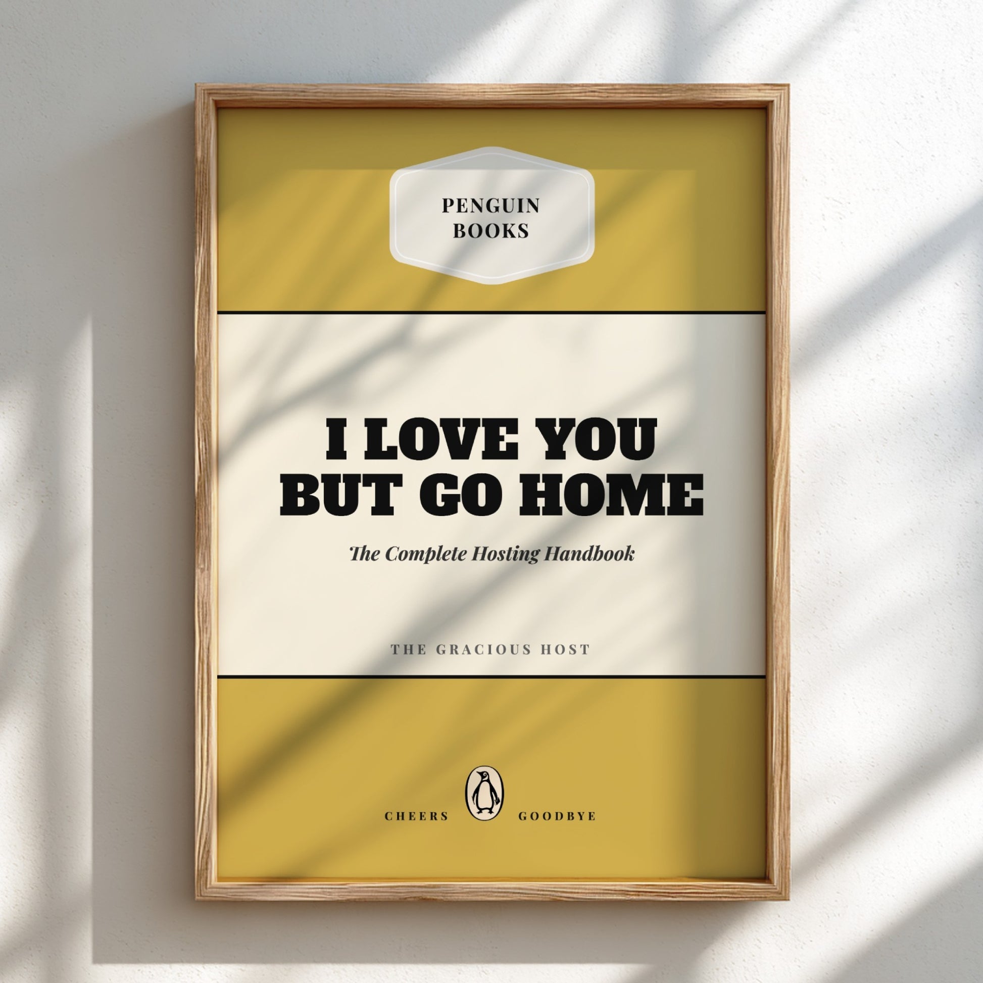 Framed book cover with 'Penguin Books' branding and text 'I Love You But Go Home'.