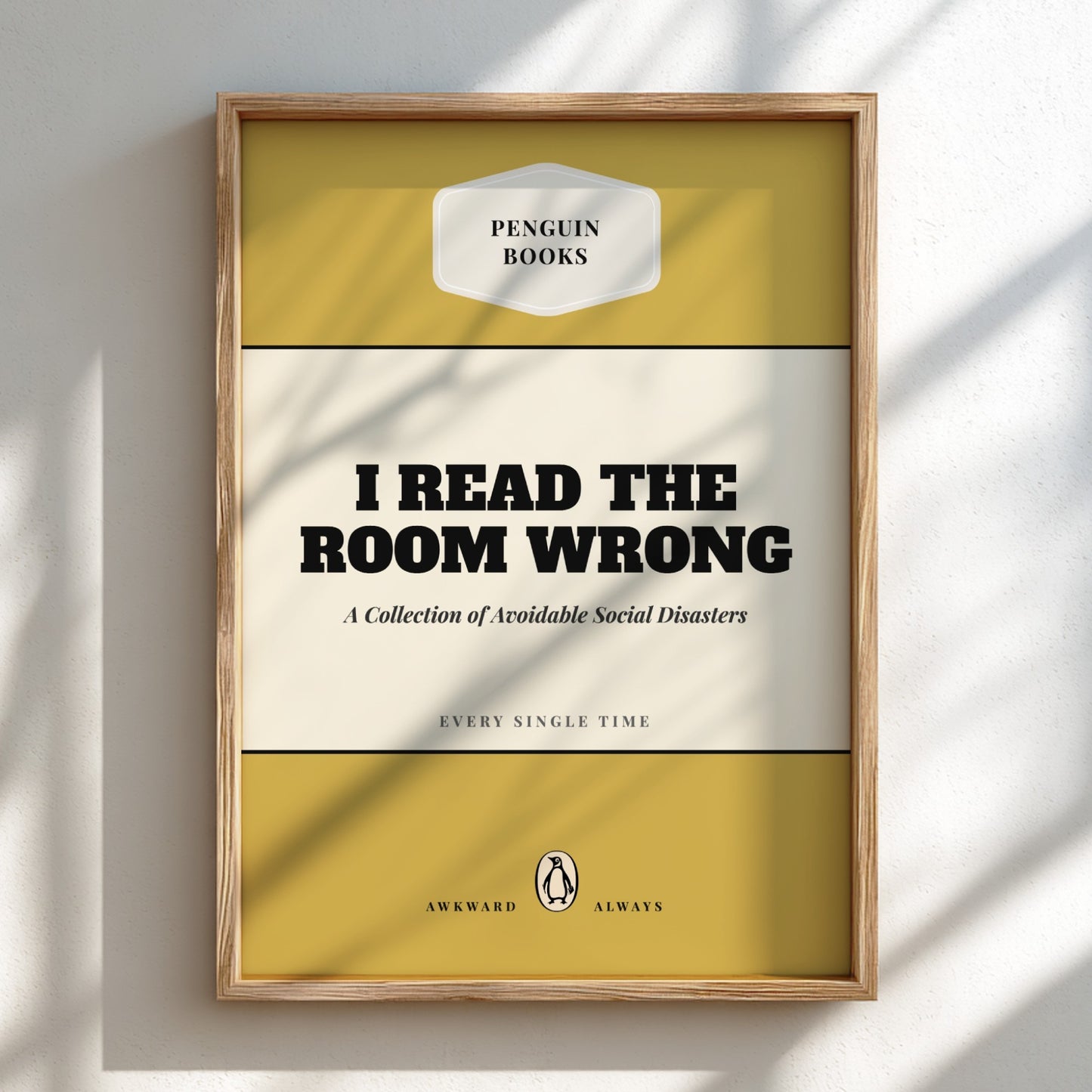 Framed book cover with 'Penguin Books' logo and humorous text on a light background