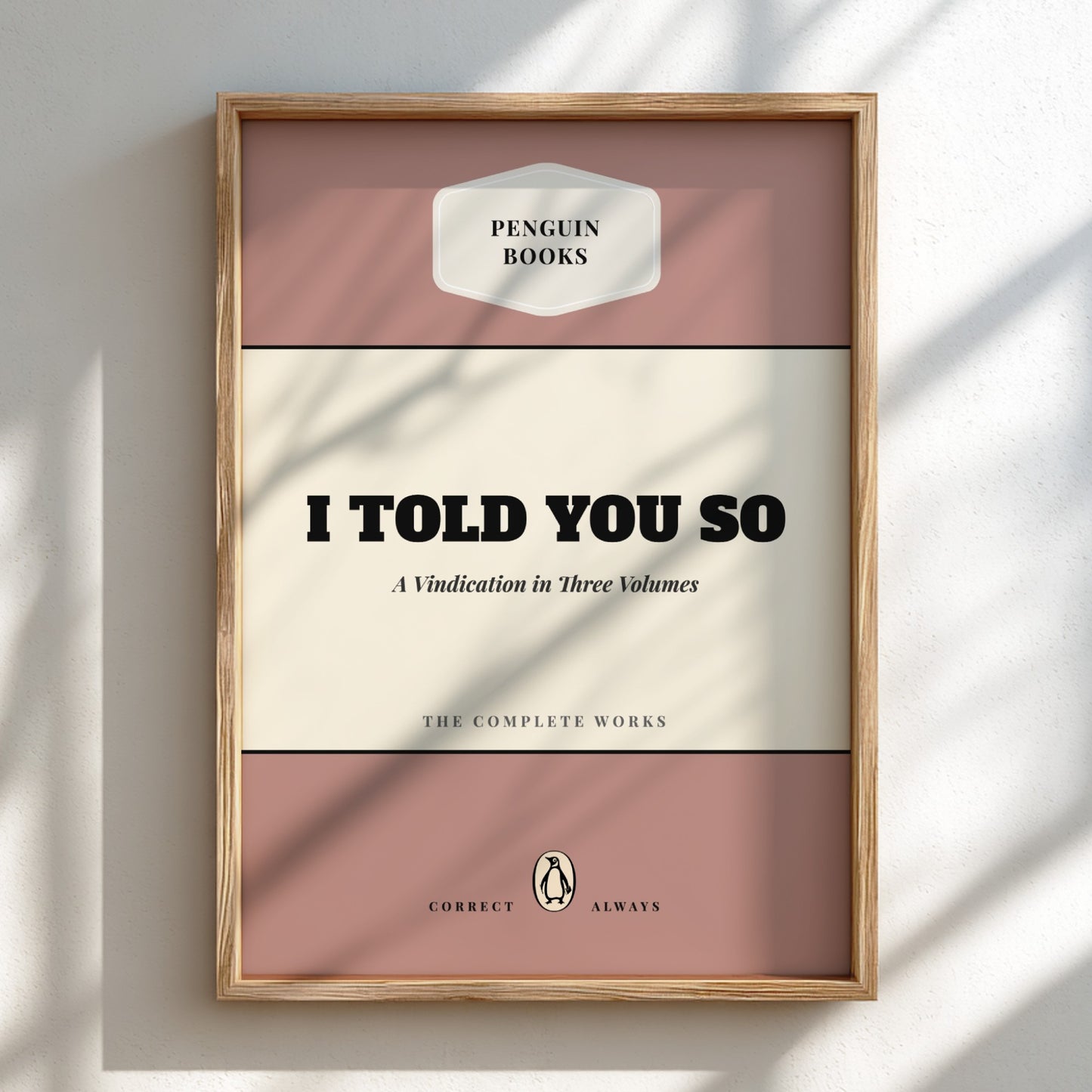 Framed book cover with 'Penguin Books' logo and text 'I Told You So'.