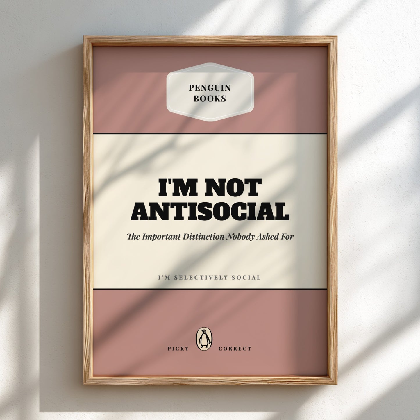 Framed poster with 'I'm Not Antisocial' text on a light background