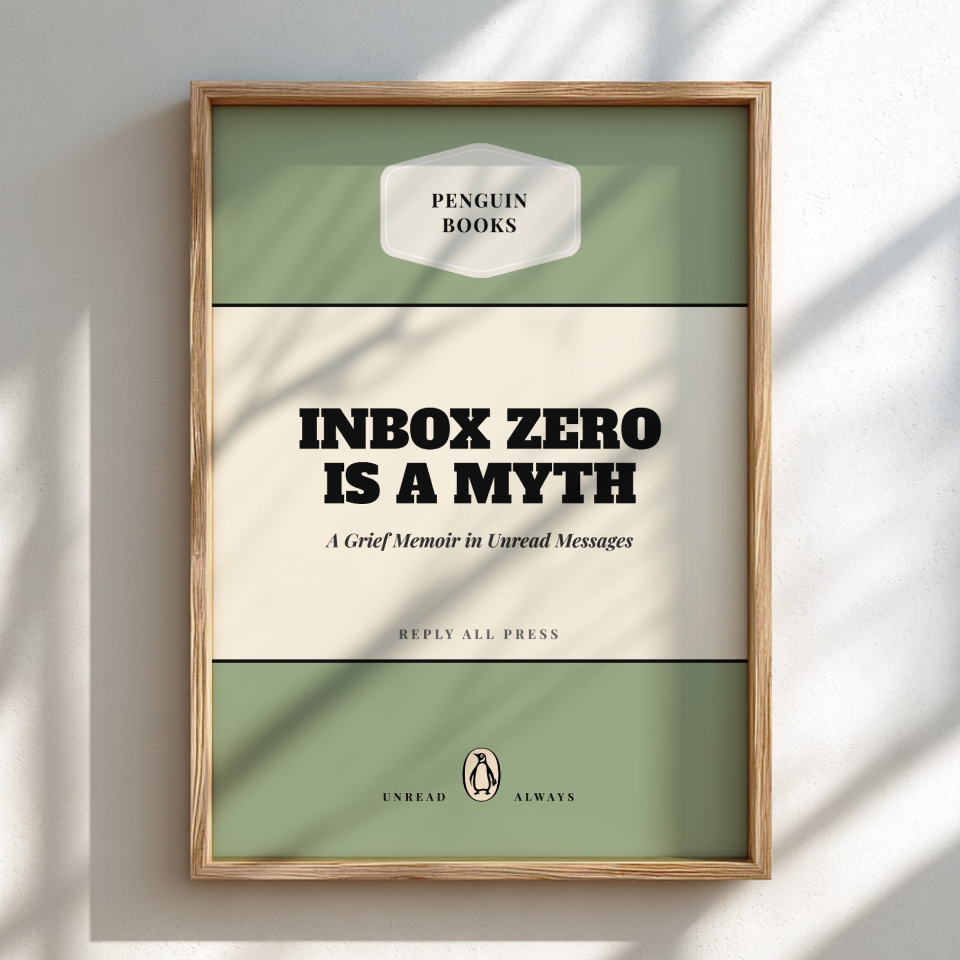 Framed book cover with 'Penguin Books' branding and text about inbox zero.