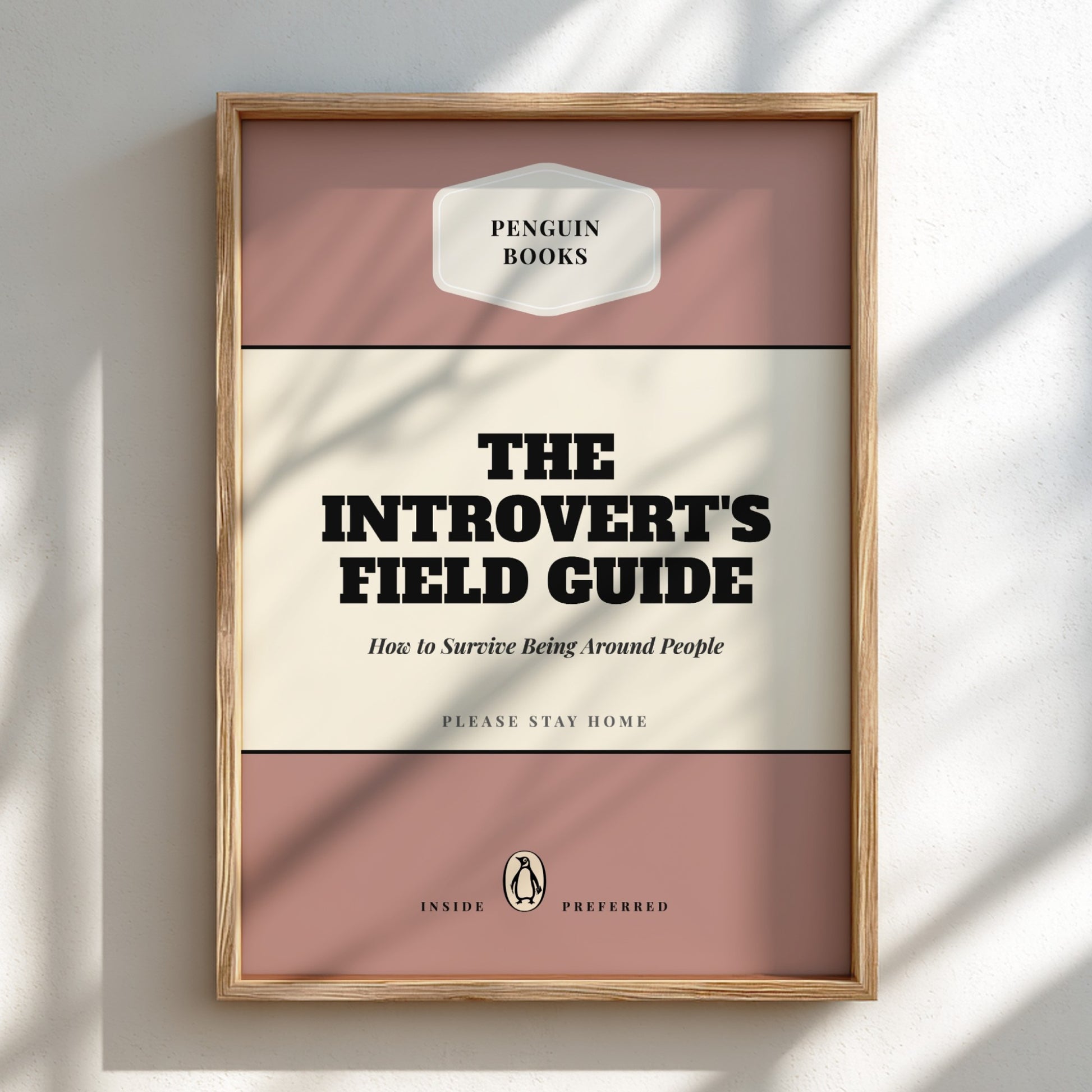 Framed book cover of 'The Introvert's Field Guide' by Penguin Books on a light background
